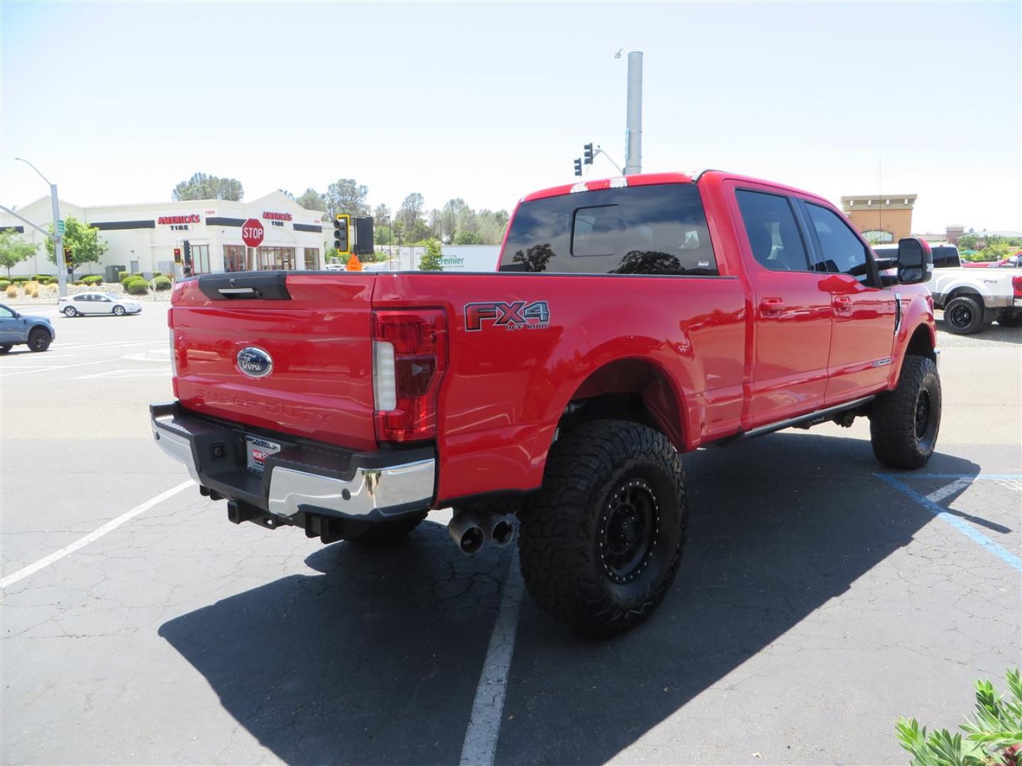 2017 Red Ford F-250 SD Lariat Crew Cab Long Bed 4WD (1FT7W2BT7HE) with an 6.7L V8 OHV 16V DIESEL engine, 6A transmission, located at 2630 Grass Valley Highway, Auburn, CA, 95603, (530) 508-5100, 38.937893, -121.095482 - Super Clean Lariat Superduty sitting on Carli Pintop suspension system, King 2.5 remote reservoir shocks, Radius Arms, High Mount stabilizer, Torsion Sway bar, and Deaver rear leaf springs, 38" Falken Wildpeak RT tires, 17" Method 315 wheels , and window tint. - Photo#4