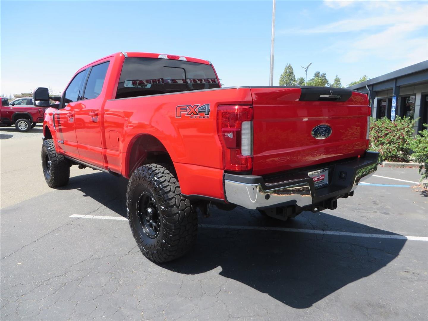 2017 Red Ford F-250 SD Lariat Crew Cab Long Bed 4WD (1FT7W2BT7HE) with an 6.7L V8 OHV 16V DIESEL engine, 6A transmission, located at 2630 Grass Valley Highway, Auburn, CA, 95603, (530) 508-5100, 38.937893, -121.095482 - Super Clean Lariat Superduty sitting on Carli Pintop suspension system, King 2.5 remote reservoir shocks, Radius Arms, High Mount stabilizer, Torsion Sway bar, and Deaver rear leaf springs, 38" Falken Wildpeak RT tires, 17" Method 315 wheels , and window tint. - Photo#6