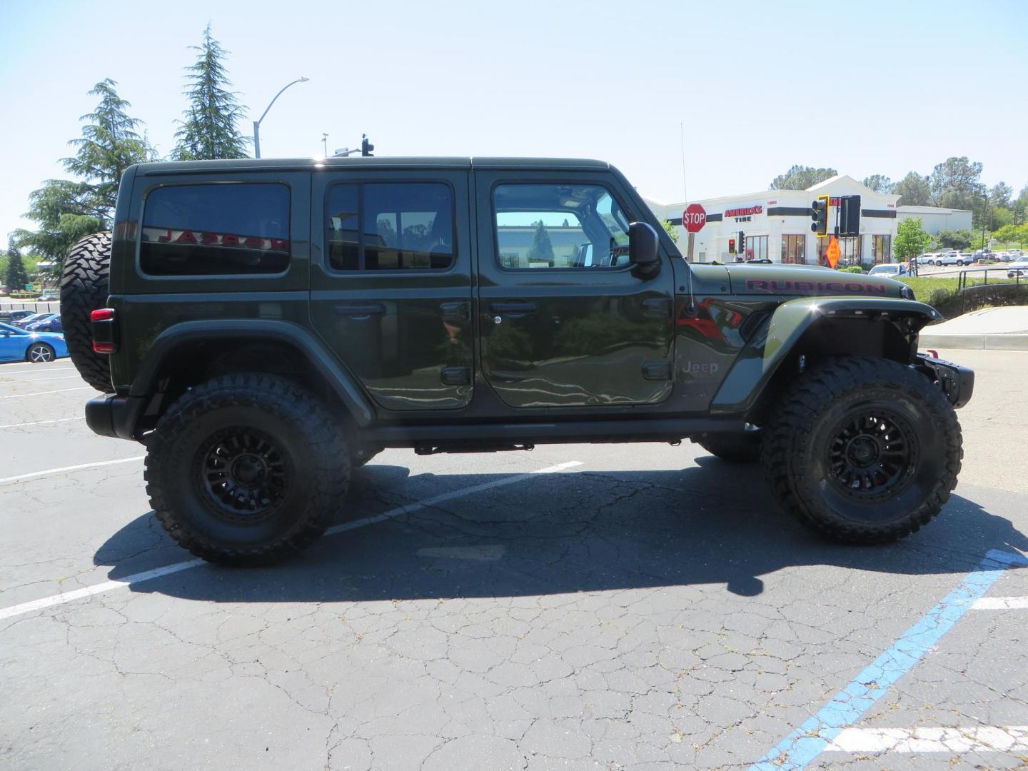 2021 GREEN Jeep Wrangler Unlimited Rubicon (1C4JJXFM6MW) with an 3.0L V6 DOHC 24V TURBO DIESEL engine, 6A transmission, located at 2630 Grass Valley Highway, Auburn, CA, 95603, (530) 508-5100, 38.937893, -121.095482 - Eco Diesel Rubicon features a JKS suspension system, Fox adventure series shocks, 17" Fuel Rincon wheels, 37" Toyo MT tires, Metal Cloak front fender guts delete, Body Armor front inner fender liners, DV8 rocker guards, Teraflex HD spare tire relocation, and Morimoto Headlights. - Photo#3