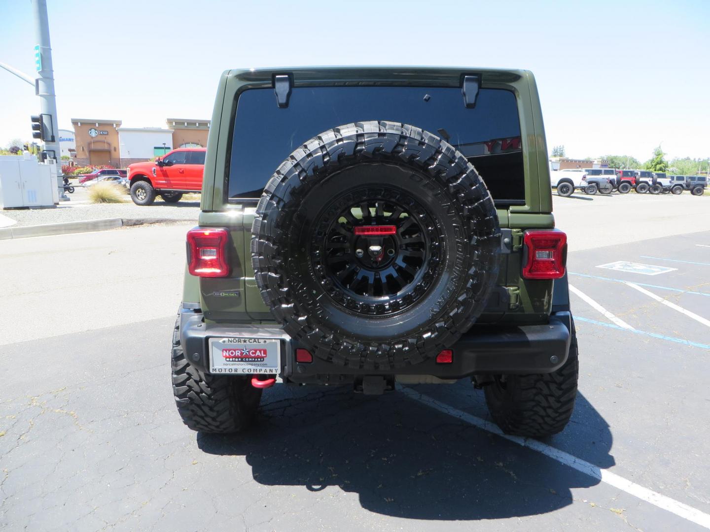 2021 GREEN Jeep Wrangler Unlimited Rubicon (1C4JJXFM6MW) with an 3.0L V6 DOHC 24V TURBO DIESEL engine, 6A transmission, located at 2630 Grass Valley Highway, Auburn, CA, 95603, (530) 508-5100, 38.937893, -121.095482 - Eco Diesel Rubicon features a JKS suspension system, Fox adventure series shocks, 17" Fuel Rincon wheels, 37" Toyo MT tires, Metal Cloak front fender guts delete, Body Armor front inner fender liners, DV8 rocker guards, Teraflex HD spare tire relocation, and Morimoto Headlights. - Photo#5