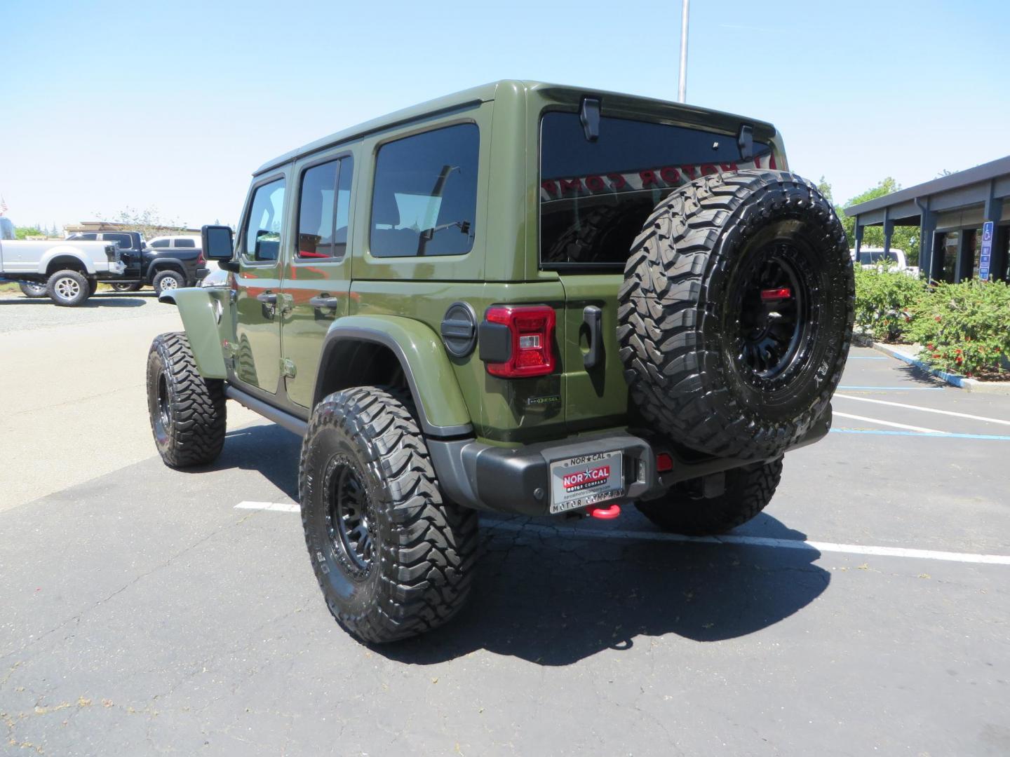 2021 GREEN Jeep Wrangler Unlimited Rubicon (1C4JJXFM6MW) with an 3.0L V6 DOHC 24V TURBO DIESEL engine, 6A transmission, located at 2630 Grass Valley Highway, Auburn, CA, 95603, (530) 508-5100, 38.937893, -121.095482 - Eco Diesel Rubicon features a JKS suspension system, Fox adventure series shocks, 17" Fuel Rincon wheels, 37" Toyo MT tires, Metal Cloak front fender guts delete, Body Armor front inner fender liners, DV8 rocker guards, Teraflex HD spare tire relocation, and Morimoto Headlights. - Photo#6