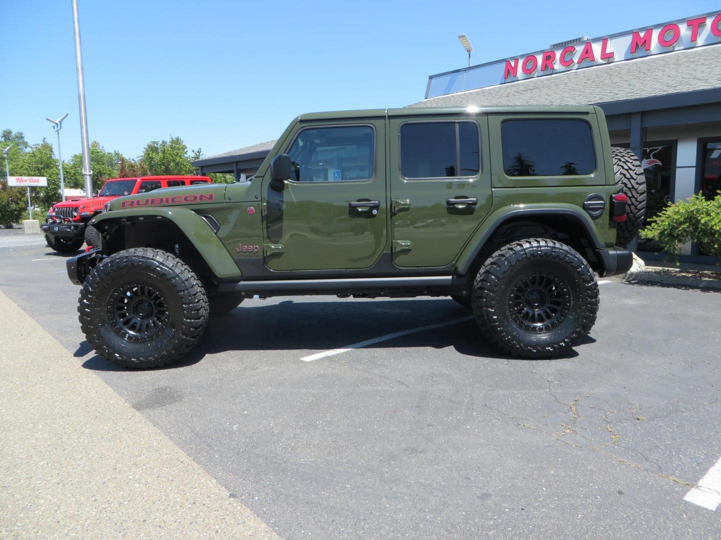 2021 GREEN Jeep Wrangler Unlimited Rubicon (1C4JJXFM6MW) with an 3.0L V6 DOHC 24V TURBO DIESEL engine, 6A transmission, located at 2630 Grass Valley Highway, Auburn, CA, 95603, (530) 508-5100, 38.937893, -121.095482 - Eco Diesel Rubicon features a JKS suspension system, Fox adventure series shocks, 17" Fuel Rincon wheels, 37" Toyo MT tires, Metal Cloak front fender guts delete, Body Armor front inner fender liners, DV8 rocker guards, Teraflex HD spare tire relocation, and Morimoto Headlights. - Photo#7