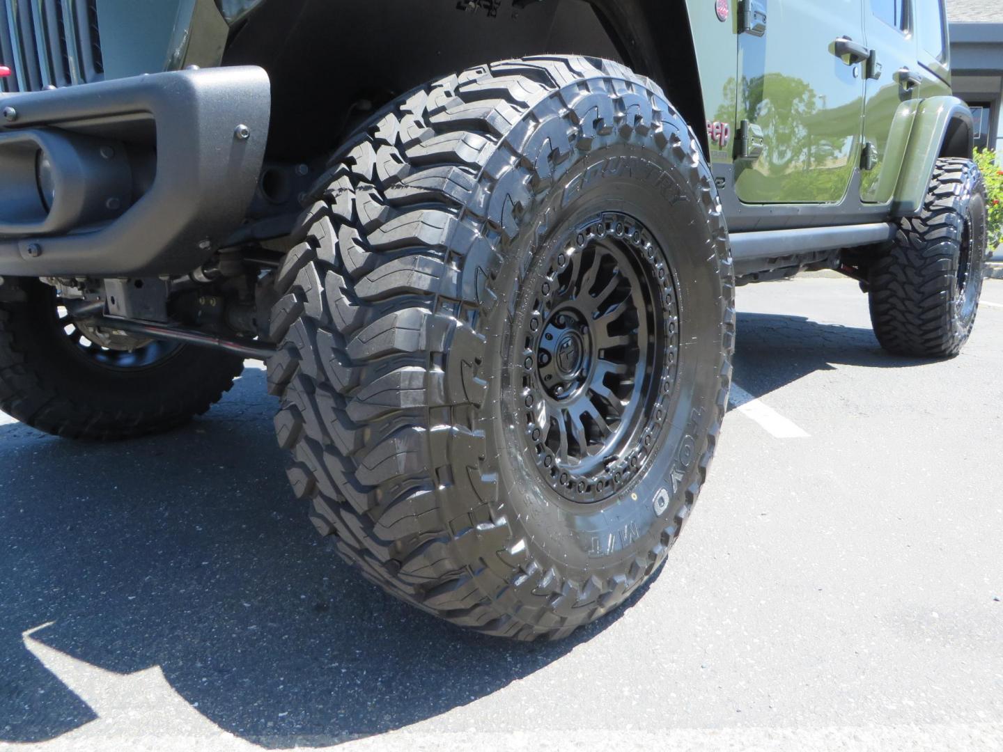 2021 GREEN Jeep Wrangler Unlimited Rubicon (1C4JJXFM6MW) with an 3.0L V6 DOHC 24V TURBO DIESEL engine, 6A transmission, located at 2630 Grass Valley Highway, Auburn, CA, 95603, (530) 508-5100, 38.937893, -121.095482 - Eco Diesel Rubicon features a JKS suspension system, Fox adventure series shocks, 17" Fuel Rincon wheels, 37" Toyo MT tires, Metal Cloak front fender guts delete, Body Armor front inner fender liners, DV8 rocker guards, Teraflex HD spare tire relocation, and Morimoto Headlights. - Photo#9