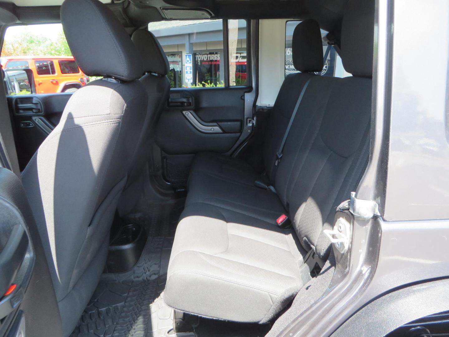 2016 CHARCOAL Jeep Wrangler Unlimited Rubicon 4WD (1C4BJWFG2GL) with an 3.6L V6 DOHC 24V FFV engine, located at 2630 Grass Valley Highway, Auburn, CA, 95603, (530) 508-5100, 38.937893, -121.095482 - JK with a ton of extras..... Lifted, Fox shocks, 37" Cooper STT Pro tires, XD wheels, VKS front bumper, Genright rear bumper, Smittybilt fenders, Inner fender liners, Poison Spyder Rock Sliders, Antirock sway bar, Upgraded Steering with Fox stabilizer, G2 front and rear differential covers, Rigid In - Photo#50