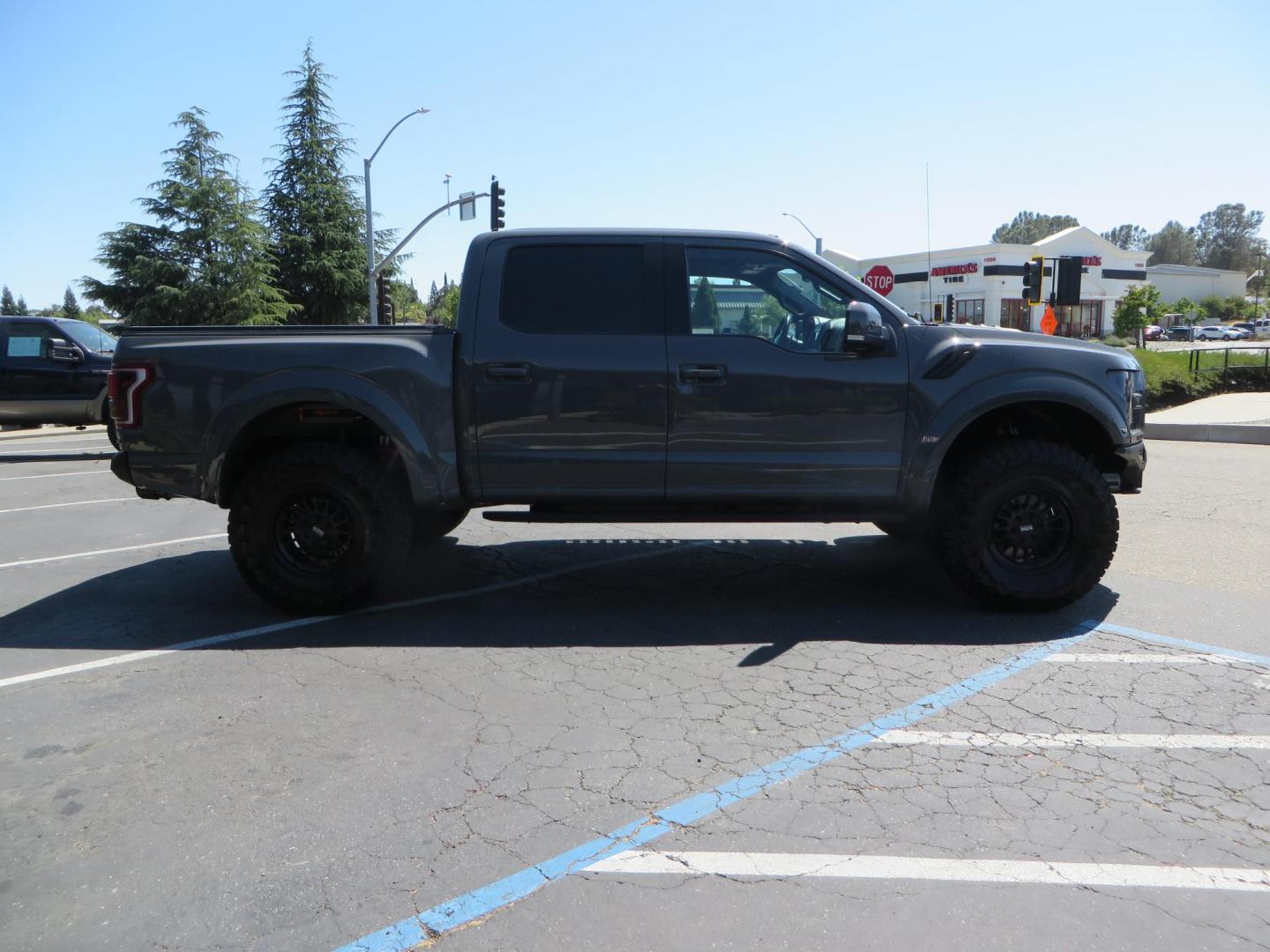 2018 Gray Ford F-150 Raptor SuperCrew 4WD (1FTFW1RG4JF) with an 3.5 V6 engine, 6A transmission, located at 2630 Grass Valley Highway, Auburn, CA, 95603, (530) 508-5100, 38.937893, -121.095482 - Must see Raptor with a bunch of new accessories. We just install Fox 3.0 live valve coilovers and rear shocks, Fox IFP rear bumps with SVC bump stop brackets, SDI E Click, Addictive Desert Designs front and rear bumpers, Baja Designs Led lighting, Addictive Desert Designs Intercooler, KMC Impact for - Photo#3