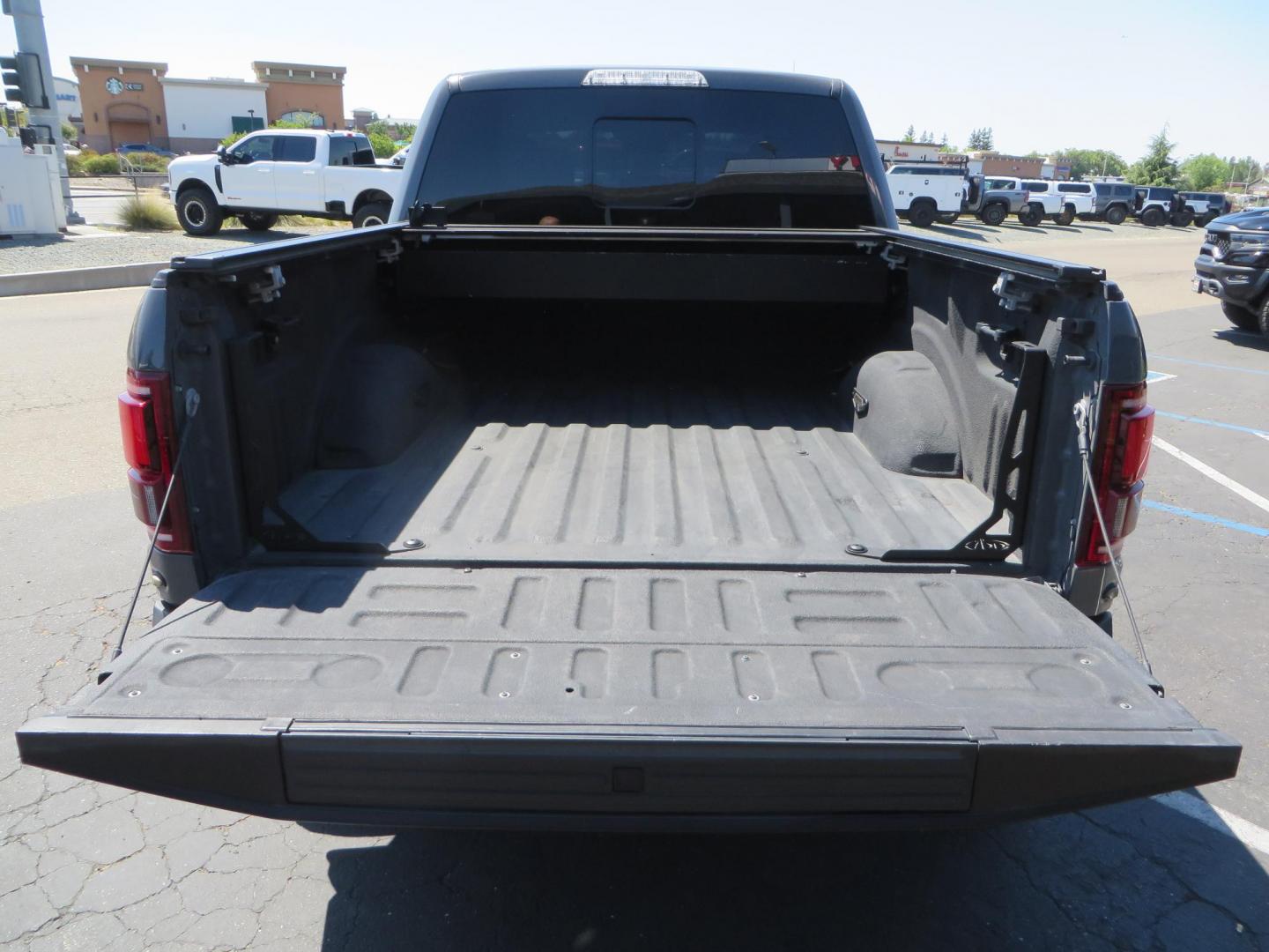 2018 Gray Ford F-150 Raptor SuperCrew 4WD (1FTFW1RG4JF) with an 3.5 V6 engine, 6A transmission, located at 2630 Grass Valley Highway, Auburn, CA, 95603, (530) 508-5100, 38.937893, -121.095482 - Must see Raptor with a bunch of new accessories. We just install Fox 3.0 live valve coilovers and rear shocks, Fox IFP rear bumps with SVC bump stop brackets, SDI E Click, Addictive Desert Designs front and rear bumpers, Baja Designs Led lighting, Addictive Desert Designs Intercooler, KMC Impact for - Photo#21