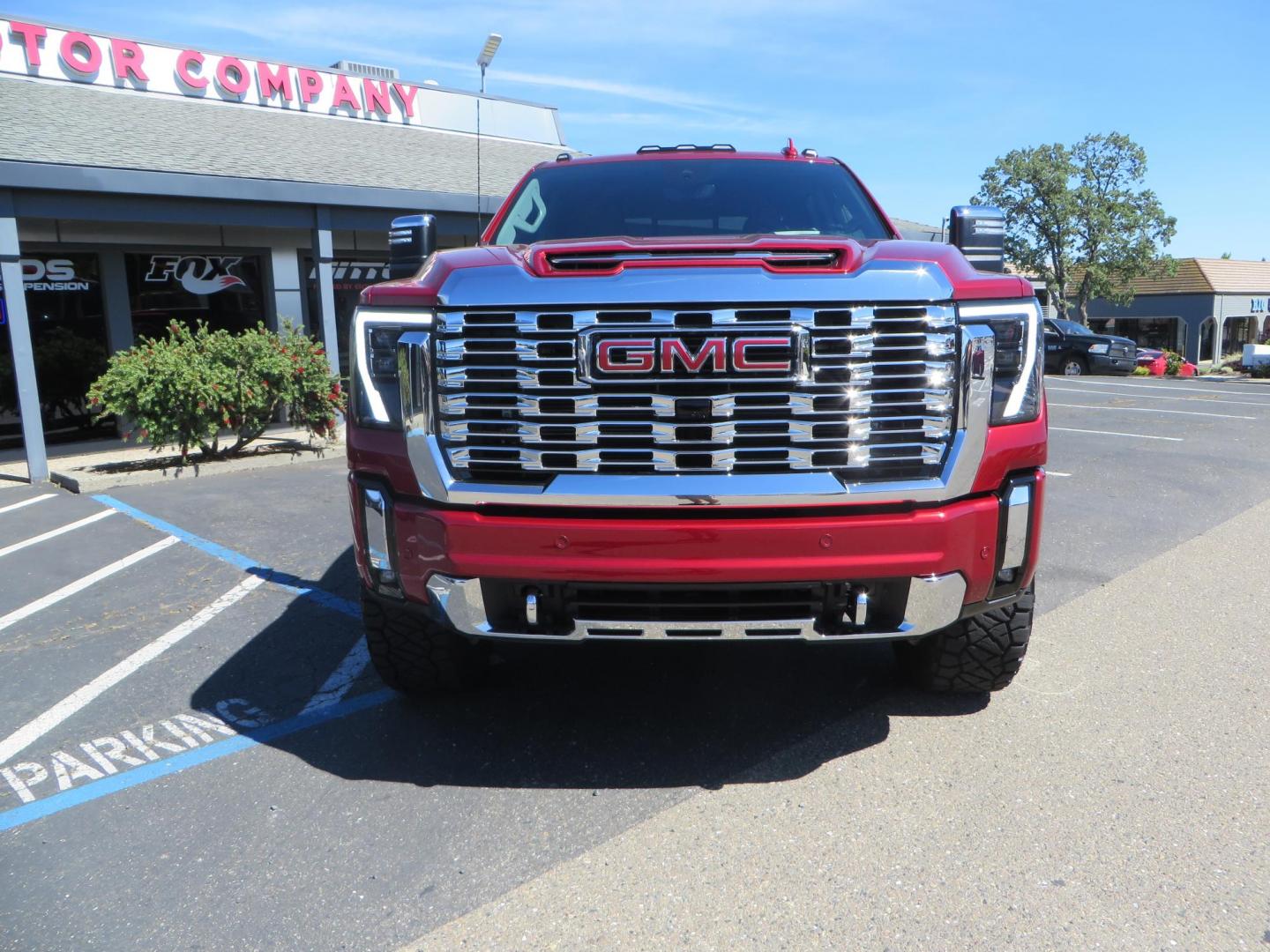 2024 Volcanic Red /Black GMC Sierra 2500HD Denali Crew Cab 4WD SB (1GT49REY6RF) with an 6.6L V8 OHV 16V TURBO DIESEL engine, 6A transmission, located at 2630 Grass Valley Highway, Auburn, CA, 95603, (530) 508-5100, 38.937893, -121.095482 - Denali 2500 featuring a Cognito Level kit, Fox shocks, 20" Fittipaldi FA18 wheels, 35" Nitto Ridge Grappler tires, and a LineX folding tonneau cover. - Photo#1