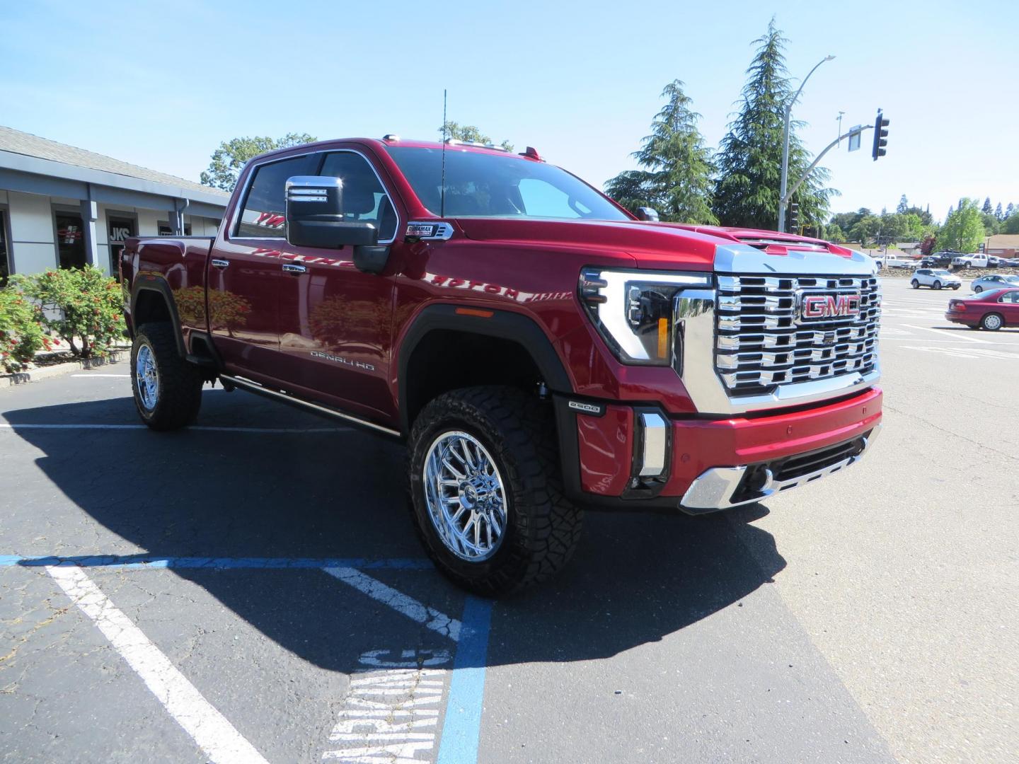 2024 Volcanic Red /Black GMC Sierra 2500HD Denali Crew Cab 4WD SB (1GT49REY6RF) with an 6.6L V8 OHV 16V TURBO DIESEL engine, 6A transmission, located at 2630 Grass Valley Highway, Auburn, CA, 95603, (530) 508-5100, 38.937893, -121.095482 - Denali 2500 featuring a Cognito Level kit, Fox shocks, 20" Fittipaldi FA18 wheels, 35" Nitto Ridge Grappler tires, and a LineX folding tonneau cover. - Photo#2
