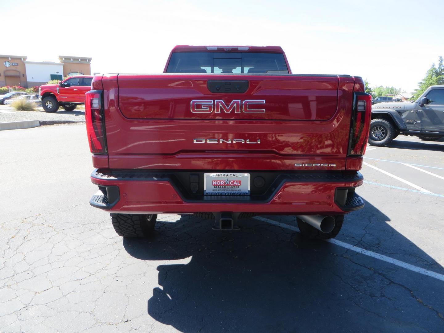 2024 Volcanic Red /Black GMC Sierra 2500HD Denali Crew Cab 4WD SB (1GT49REY6RF) with an 6.6L V8 OHV 16V TURBO DIESEL engine, 6A transmission, located at 2630 Grass Valley Highway, Auburn, CA, 95603, (530) 508-5100, 38.937893, -121.095482 - Denali 2500 featuring a Cognito Level kit, Fox shocks, 20" Fittipaldi FA18 wheels, 35" Nitto Ridge Grappler tires, and a LineX folding tonneau cover. - Photo#5