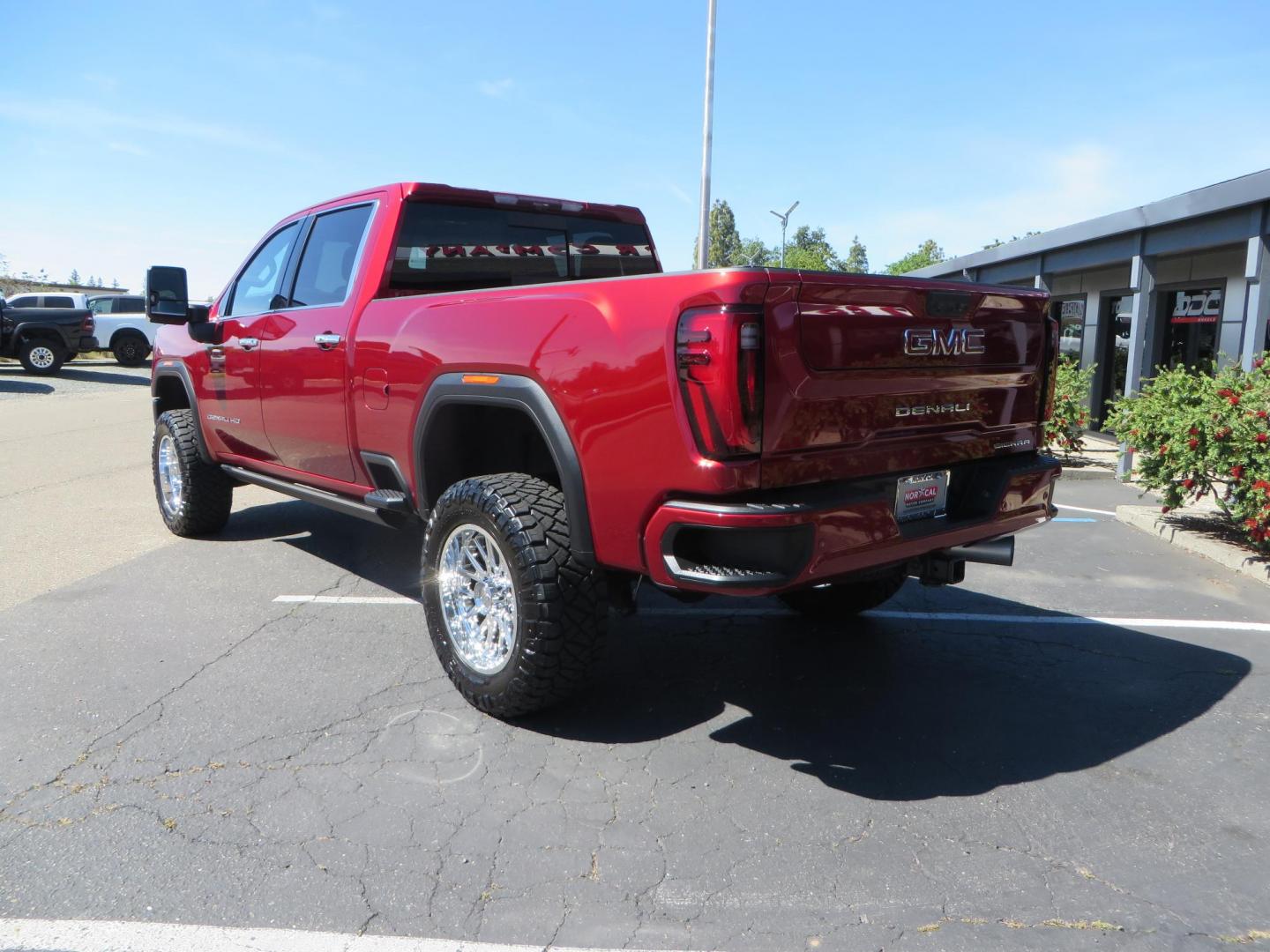 2024 Volcanic Red /Black GMC Sierra 2500HD Denali Crew Cab 4WD SB (1GT49REY6RF) with an 6.6L V8 OHV 16V TURBO DIESEL engine, 6A transmission, located at 2630 Grass Valley Highway, Auburn, CA, 95603, (530) 508-5100, 38.937893, -121.095482 - Denali 2500 featuring a Cognito Level kit, Fox shocks, 20" Fittipaldi FA18 wheels, 35" Nitto Ridge Grappler tires, and a LineX folding tonneau cover. - Photo#6