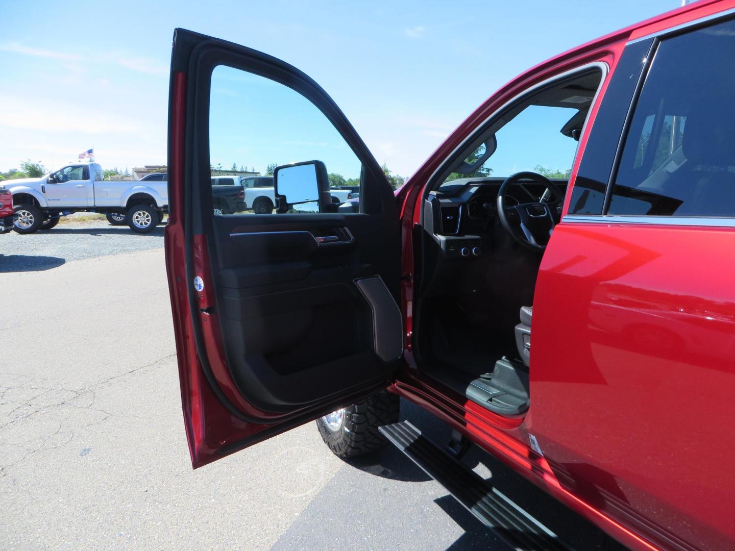 2024 Volcanic Red /Black GMC Sierra 2500HD Denali Crew Cab 4WD SB (1GT49REY6RF) with an 6.6L V8 OHV 16V TURBO DIESEL engine, 6A transmission, located at 2630 Grass Valley Highway, Auburn, CA, 95603, (530) 508-5100, 38.937893, -121.095482 - Denali 2500 featuring a Cognito Level kit, Fox shocks, 20" Fittipaldi FA18 wheels, 35" Nitto Ridge Grappler tires, and a LineX folding tonneau cover. - Photo#26