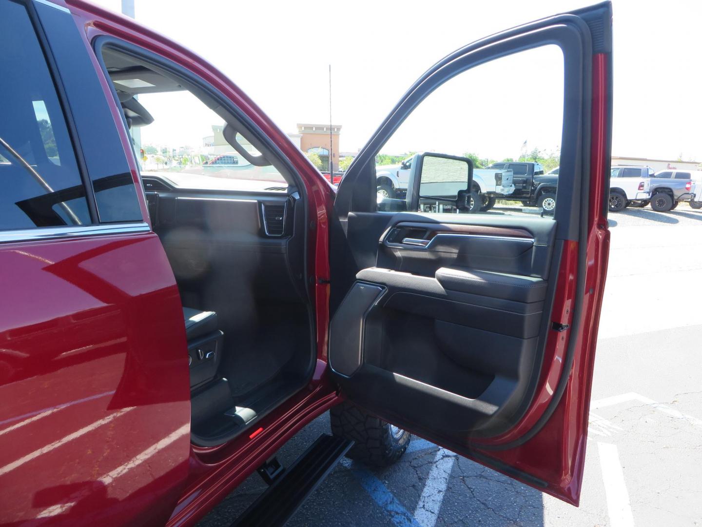 2024 Volcanic Red /Black GMC Sierra 2500HD Denali Crew Cab 4WD SB (1GT49REY6RF) with an 6.6L V8 OHV 16V TURBO DIESEL engine, 6A transmission, located at 2630 Grass Valley Highway, Auburn, CA, 95603, (530) 508-5100, 38.937893, -121.095482 - Denali 2500 featuring a Cognito Level kit, Fox shocks, 20" Fittipaldi FA18 wheels, 35" Nitto Ridge Grappler tires, and a LineX folding tonneau cover. - Photo#56