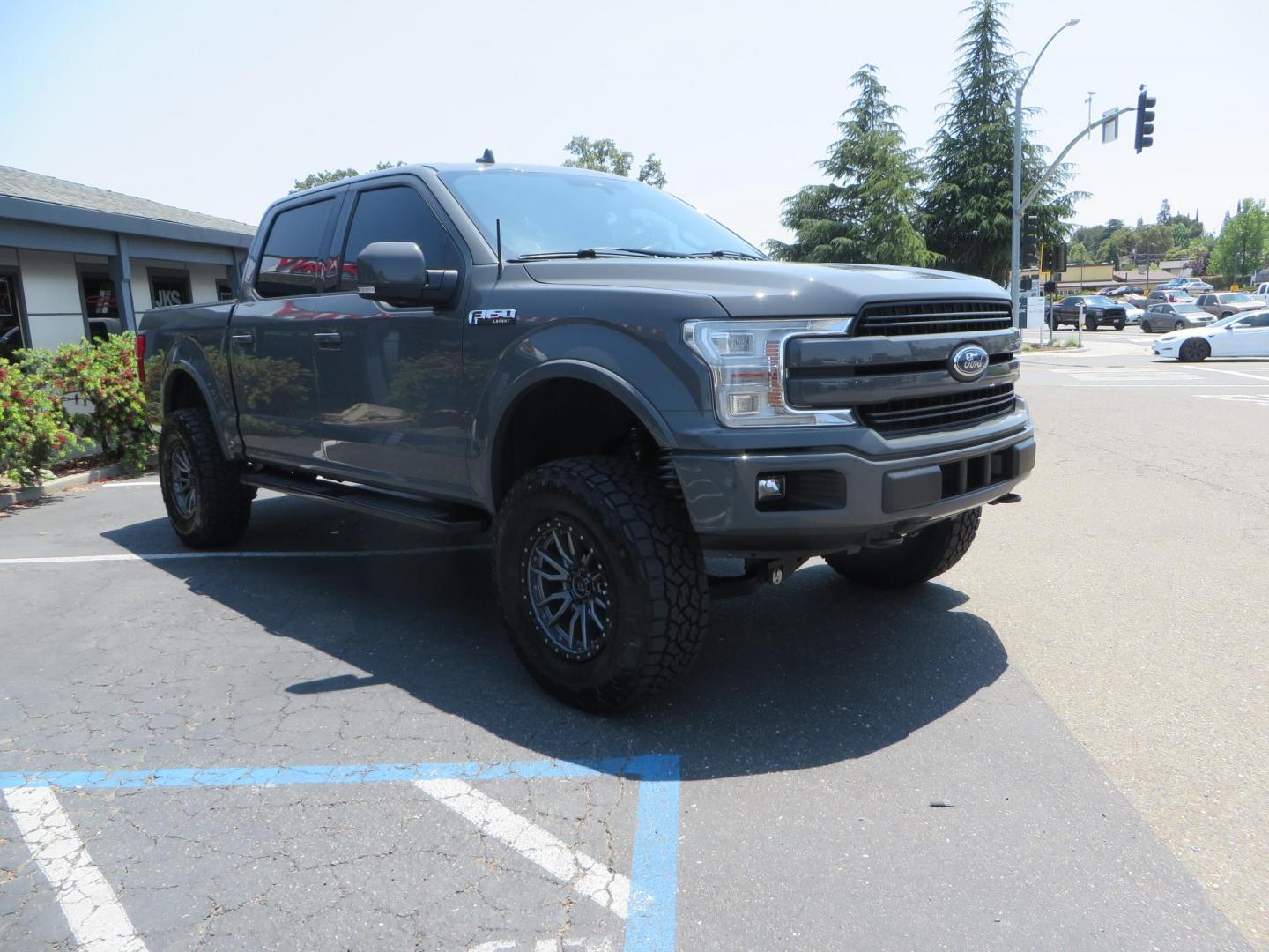 2018 Ford F-150 Lariat SuperCrew 5.5-ft. Bed 4WD (1FTEW1EG6JF) with an 3.5L V6 TURBO engine, 6A transmission, located at 2630 Grass Valley Highway, Auburn, CA, 95603, (530) 508-5100, 38.937893, -121.095482 - Sitting on a 6" Rough Country lift kit, Fox 2.5 remote reservoir coilovers, 18" Fuel Rebel wheels, 35" Toyo AT3 tires, Tonneau Cover, bed side swing case, and window tint. - Photo#2
