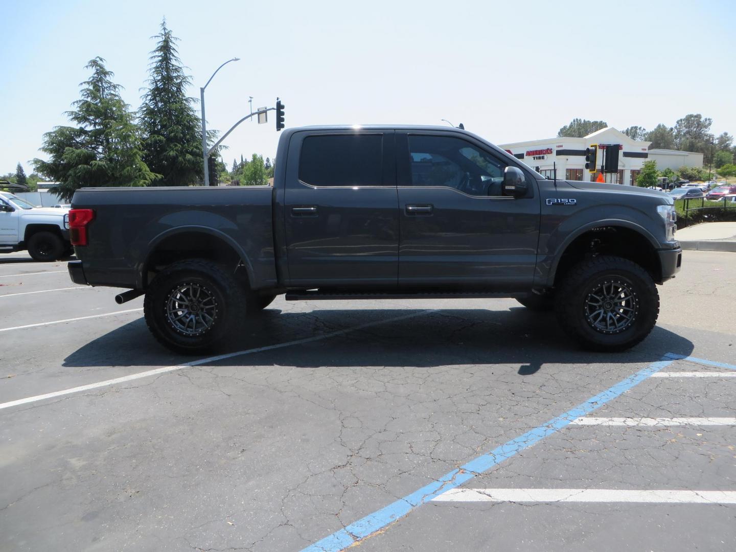 2018 Ford F-150 Lariat SuperCrew 5.5-ft. Bed 4WD (1FTEW1EG6JF) with an 3.5L V6 TURBO engine, 6A transmission, located at 2630 Grass Valley Highway, Auburn, CA, 95603, (530) 508-5100, 38.937893, -121.095482 - Sitting on a 6" Rough Country lift kit, Fox 2.5 remote reservoir coilovers, 18" Fuel Rebel wheels, 35" Toyo AT3 tires, Tonneau Cover, bed side swing case, and window tint. - Photo#3