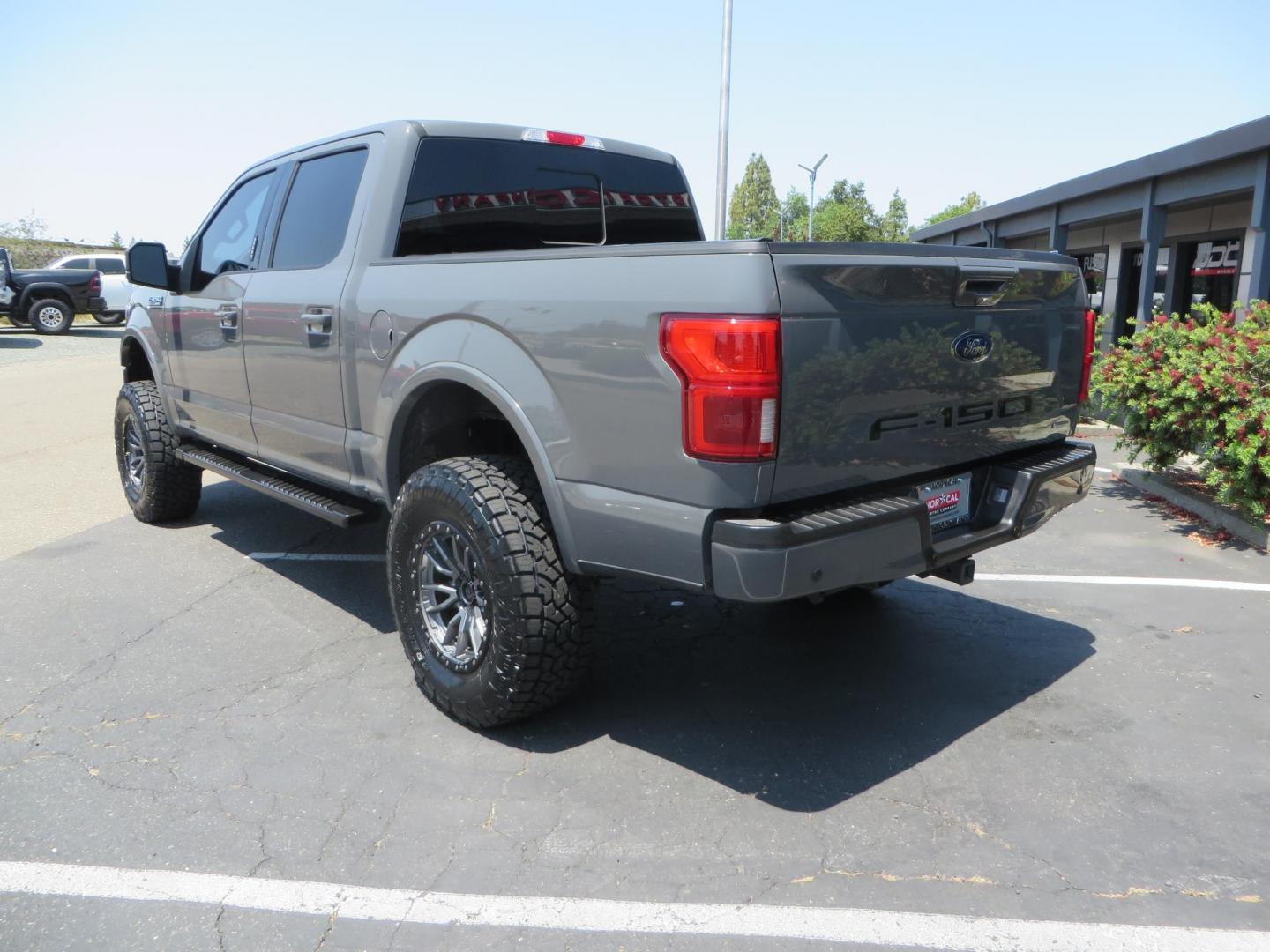 2018 Ford F-150 Lariat SuperCrew 5.5-ft. Bed 4WD (1FTEW1EG6JF) with an 3.5L V6 TURBO engine, 6A transmission, located at 2630 Grass Valley Highway, Auburn, CA, 95603, (530) 508-5100, 38.937893, -121.095482 - Sitting on a 6" Rough Country lift kit, Fox 2.5 remote reservoir coilovers, 18" Fuel Rebel wheels, 35" Toyo AT3 tires, Tonneau Cover, bed side swing case, and window tint. - Photo#6