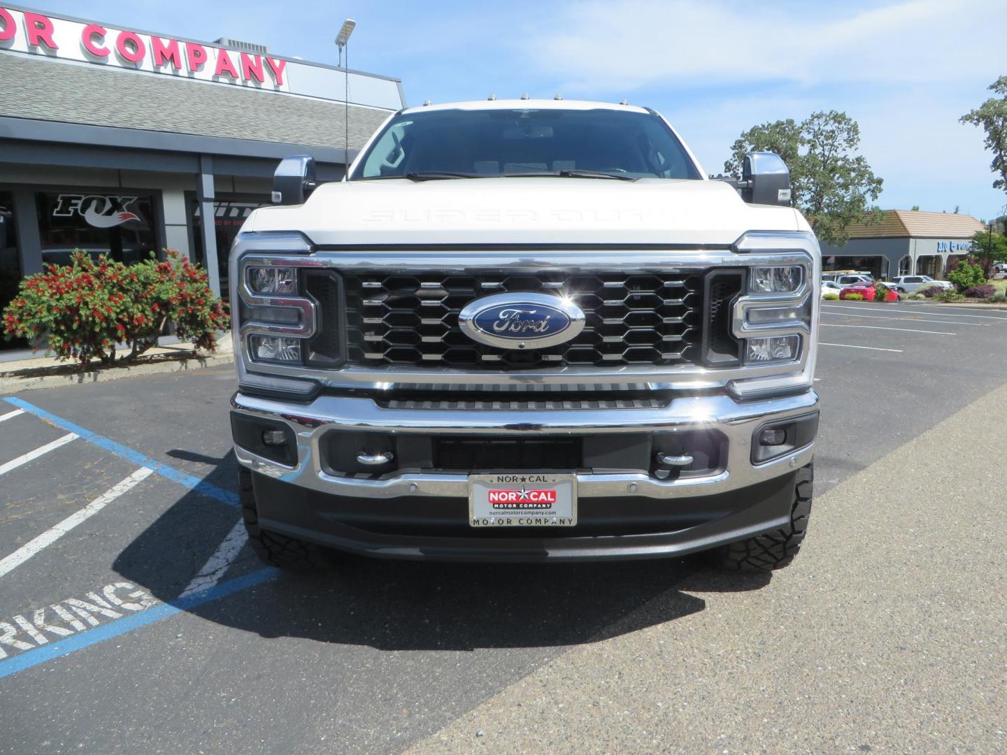2023 White Ford F-350 SD Lariat Crew Cab Long Bed DRW 4WD (1FT8W3DM9PE) with an 6.7L V8 OHV 16V DIESEL engine, 6A transmission, located at 2630 Grass Valley Highway, Auburn, CA, 95603, (530) 508-5100, 38.937893, -121.095482 - Features a BDS 3" radius arm suspension system, Fox 2.0 shocks, 20" DDC Aftermath wheels, 37" Nitto Ridge Grappler tires, Weathertech Floorliners, DeeZee bed mat, and a Pedal Commander. - Photo#1