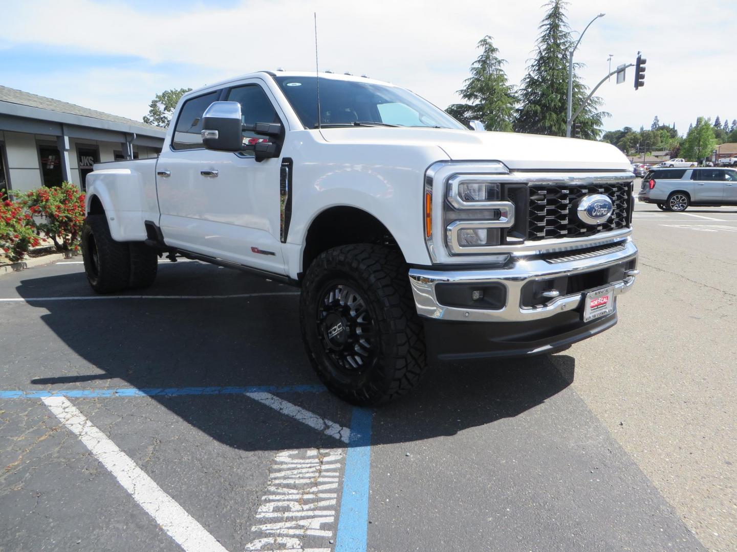 2023 White Ford F-350 SD Lariat Crew Cab Long Bed DRW 4WD (1FT8W3DM9PE) with an 6.7L V8 OHV 16V DIESEL engine, 6A transmission, located at 2630 Grass Valley Highway, Auburn, CA, 95603, (530) 508-5100, 38.937893, -121.095482 - Features a BDS 3" radius arm suspension system, Fox 2.0 shocks, 20" DDC Aftermath wheels, 37" Nitto Ridge Grappler tires, Weathertech Floorliners, DeeZee bed mat, and a Pedal Commander. - Photo#2