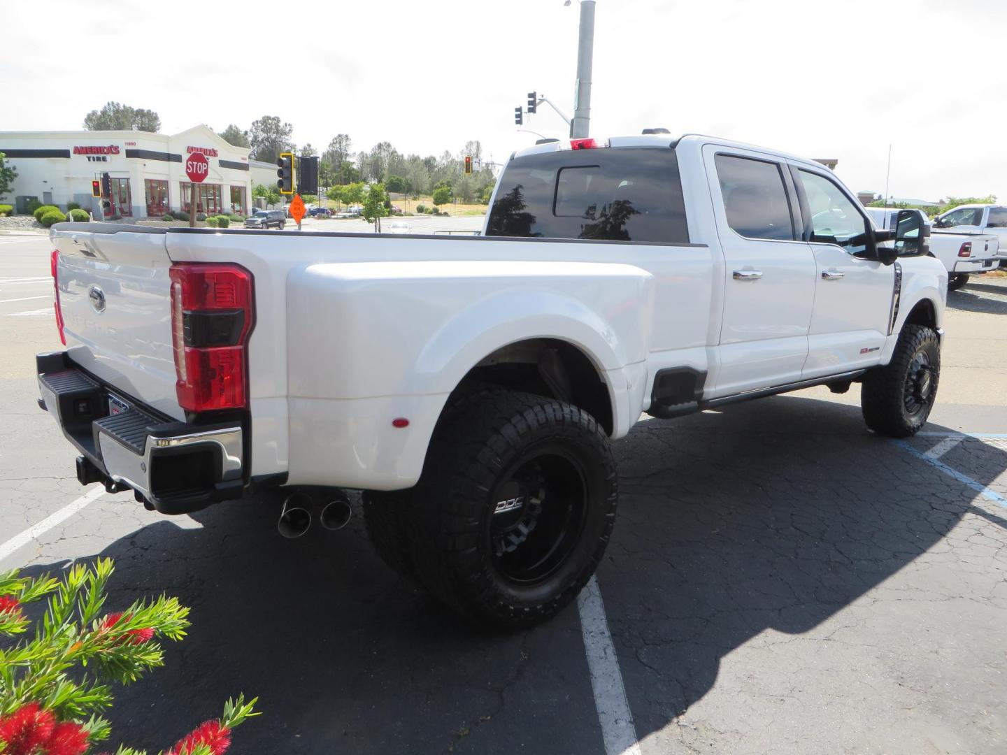 2023 White Ford F-350 SD Lariat Crew Cab Long Bed DRW 4WD (1FT8W3DM9PE) with an 6.7L V8 OHV 16V DIESEL engine, 6A transmission, located at 2630 Grass Valley Highway, Auburn, CA, 95603, (530) 508-5100, 38.937893, -121.095482 - Features a BDS 3" radius arm suspension system, Fox 2.0 shocks, 20" DDC Aftermath wheels, 37" Nitto Ridge Grappler tires, Weathertech Floorliners, DeeZee bed mat, and a Pedal Commander. - Photo#4