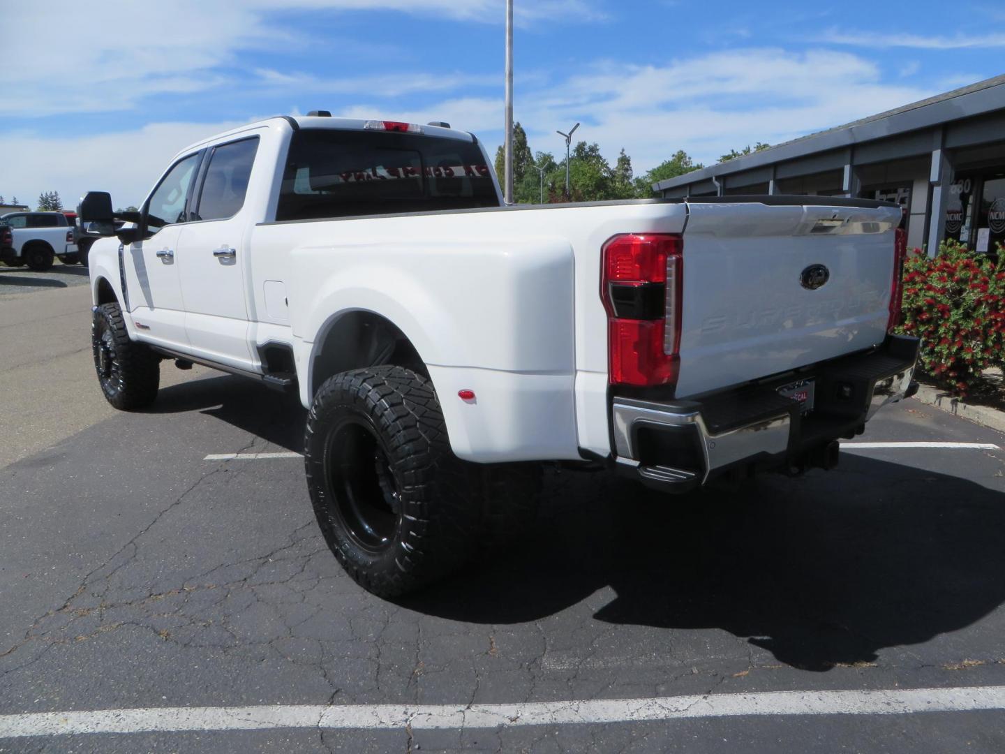 2023 White Ford F-350 SD Lariat Crew Cab Long Bed DRW 4WD (1FT8W3DM9PE) with an 6.7L V8 OHV 16V DIESEL engine, 6A transmission, located at 2630 Grass Valley Highway, Auburn, CA, 95603, (530) 508-5100, 38.937893, -121.095482 - Features a BDS 3" radius arm suspension system, Fox 2.0 shocks, 20" DDC Aftermath wheels, 37" Nitto Ridge Grappler tires, Weathertech Floorliners, DeeZee bed mat, and a Pedal Commander. - Photo#6