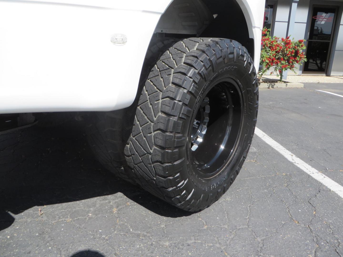 2023 White Ford F-350 SD Lariat Crew Cab Long Bed DRW 4WD (1FT8W3DM9PE) with an 6.7L V8 OHV 16V DIESEL engine, 6A transmission, located at 2630 Grass Valley Highway, Auburn, CA, 95603, (530) 508-5100, 38.937893, -121.095482 - Features a BDS 3" radius arm suspension system, Fox 2.0 shocks, 20" DDC Aftermath wheels, 37" Nitto Ridge Grappler tires, Weathertech Floorliners, DeeZee bed mat, and a Pedal Commander. - Photo#11