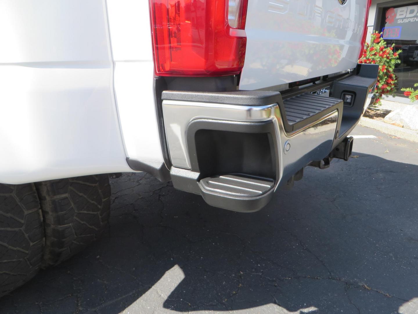 2023 White Ford F-350 SD Lariat Crew Cab Long Bed DRW 4WD (1FT8W3DM9PE) with an 6.7L V8 OHV 16V DIESEL engine, 6A transmission, located at 2630 Grass Valley Highway, Auburn, CA, 95603, (530) 508-5100, 38.937893, -121.095482 - Features a BDS 3" radius arm suspension system, Fox 2.0 shocks, 20" DDC Aftermath wheels, 37" Nitto Ridge Grappler tires, Weathertech Floorliners, DeeZee bed mat, and a Pedal Commander. - Photo#16