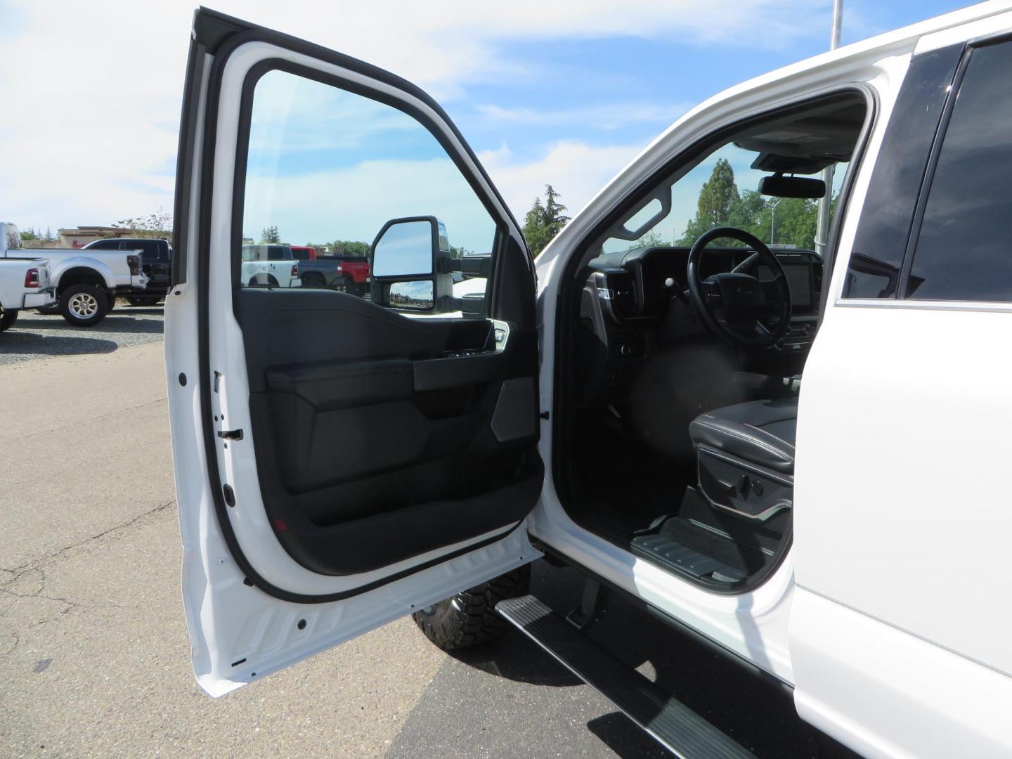 2023 White Ford F-350 SD Lariat Crew Cab Long Bed DRW 4WD (1FT8W3DM9PE) with an 6.7L V8 OHV 16V DIESEL engine, 6A transmission, located at 2630 Grass Valley Highway, Auburn, CA, 95603, (530) 508-5100, 38.937893, -121.095482 - Features a BDS 3" radius arm suspension system, Fox 2.0 shocks, 20" DDC Aftermath wheels, 37" Nitto Ridge Grappler tires, Weathertech Floorliners, DeeZee bed mat, and a Pedal Commander. - Photo#24
