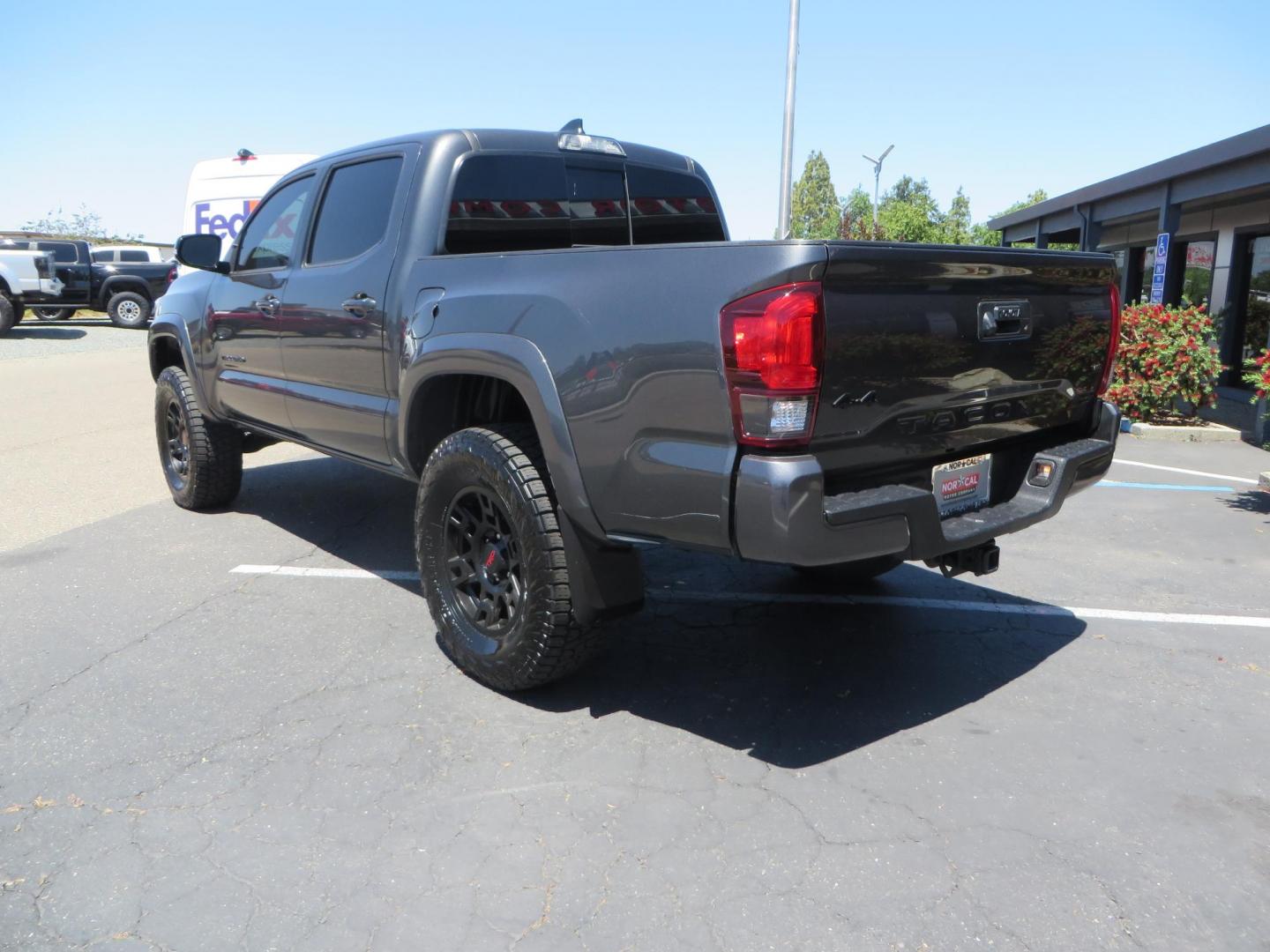 2018 CHARCOAL Toyota Tacoma TRD Sport Double Cab V6 6AT 4WD (3TMCZ5AN1JM) with an 3.6L V6 DOHC 24V engine, 6A transmission, located at 2630 Grass Valley Highway, Auburn, CA, 95603, (530) 508-5100, 38.937893, -121.095482 - Features a level kit, Nitto Terra Grappler G3 tires, TRD exhaust, and window tint. - Photo#6