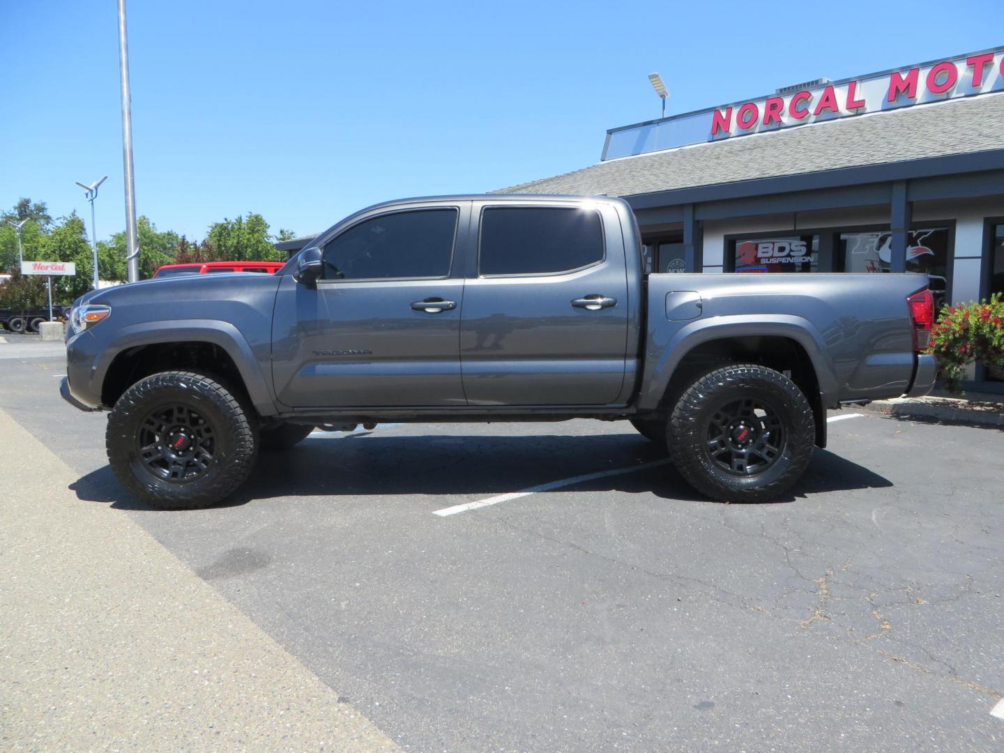 2018 CHARCOAL Toyota Tacoma TRD Sport Double Cab V6 6AT 4WD (3TMCZ5AN1JM) with an 3.6L V6 DOHC 24V engine, 6A transmission, located at 2630 Grass Valley Highway, Auburn, CA, 95603, (530) 508-5100, 38.937893, -121.095482 - Features a level kit, Nitto Terra Grappler G3 tires, TRD exhaust, and window tint. - Photo#7