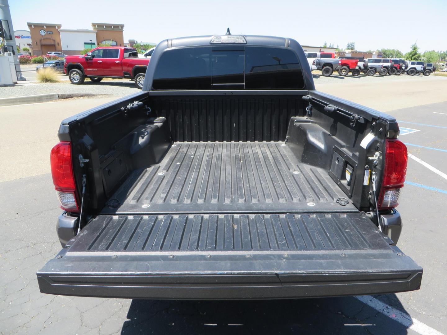 2018 CHARCOAL Toyota Tacoma TRD Sport Double Cab V6 6AT 4WD (3TMCZ5AN1JM) with an 3.6L V6 DOHC 24V engine, 6A transmission, located at 2630 Grass Valley Highway, Auburn, CA, 95603, (530) 508-5100, 38.937893, -121.095482 - Features a level kit, Nitto Terra Grappler G3 tires, TRD exhaust, and window tint. - Photo#10
