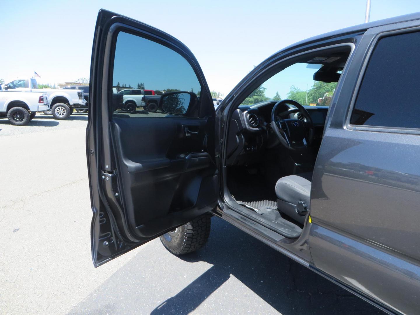 2018 CHARCOAL Toyota Tacoma TRD Sport Double Cab V6 6AT 4WD (3TMCZ5AN1JM) with an 3.6L V6 DOHC 24V engine, 6A transmission, located at 2630 Grass Valley Highway, Auburn, CA, 95603, (530) 508-5100, 38.937893, -121.095482 - Features a level kit, Nitto Terra Grappler G3 tires, TRD exhaust, and window tint. - Photo#13