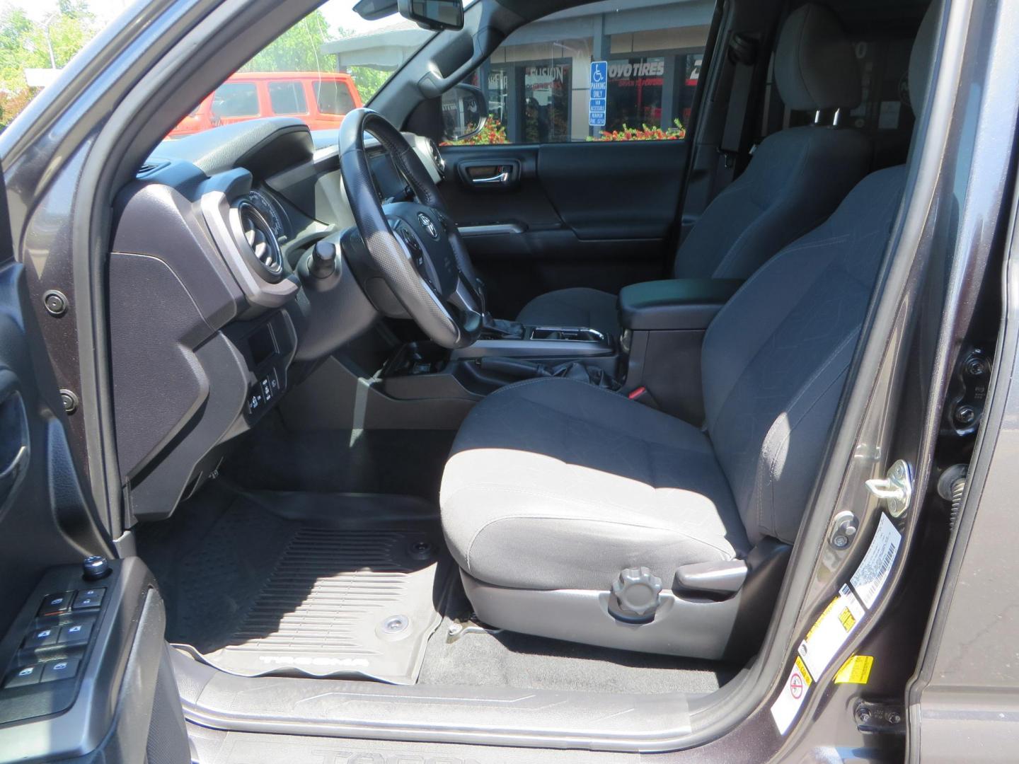 2018 CHARCOAL Toyota Tacoma TRD Sport Double Cab V6 6AT 4WD (3TMCZ5AN1JM) with an 3.6L V6 DOHC 24V engine, 6A transmission, located at 2630 Grass Valley Highway, Auburn, CA, 95603, (530) 508-5100, 38.937893, -121.095482 - Features a level kit, Nitto Terra Grappler G3 tires, TRD exhaust, and window tint. - Photo#16