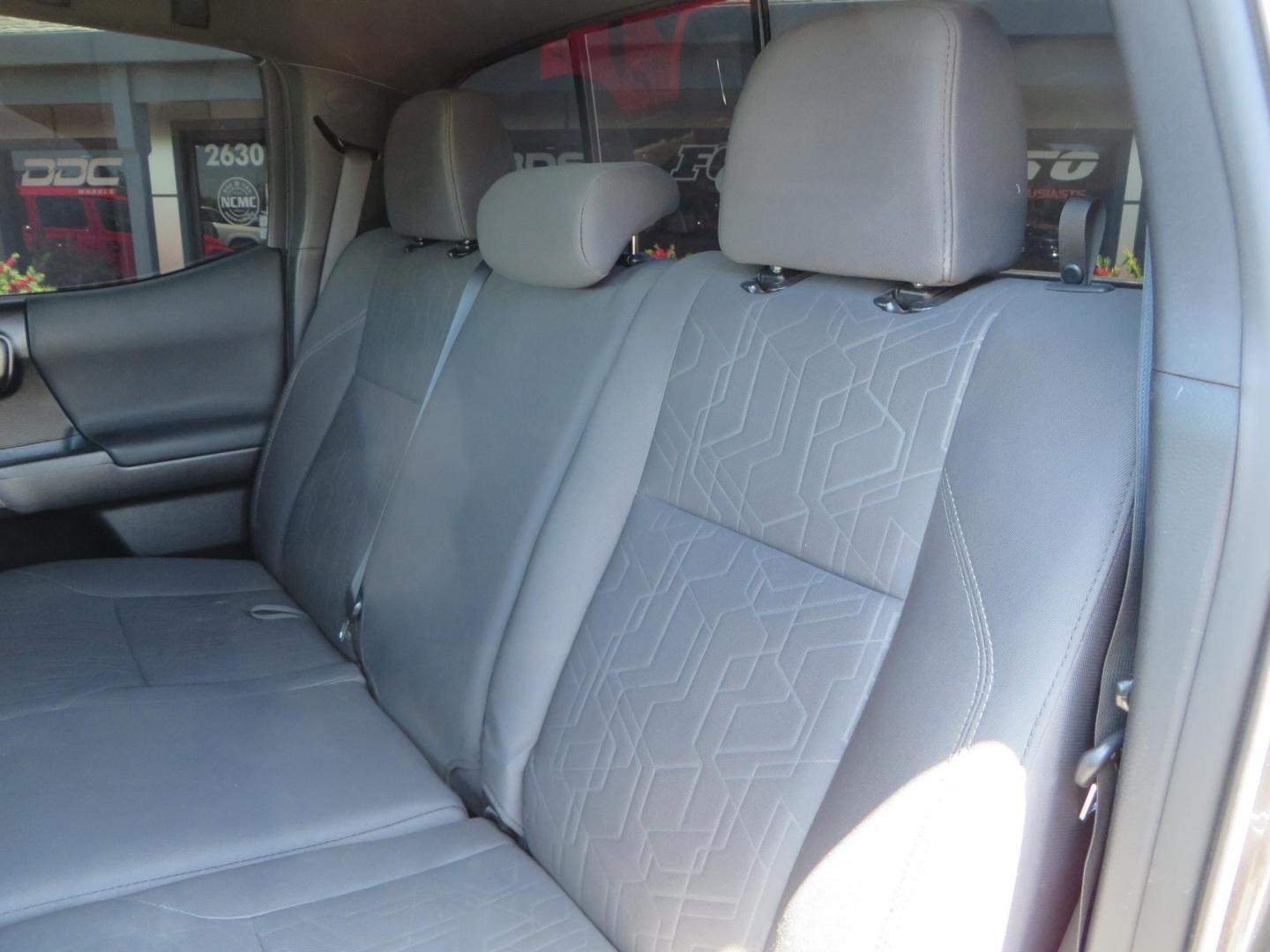 2018 CHARCOAL Toyota Tacoma TRD Sport Double Cab V6 6AT 4WD (3TMCZ5AN1JM) with an 3.6L V6 DOHC 24V engine, 6A transmission, located at 2630 Grass Valley Highway, Auburn, CA, 95603, (530) 508-5100, 38.937893, -121.095482 - Features a level kit, Nitto Terra Grappler G3 tires, TRD exhaust, and window tint. - Photo#37