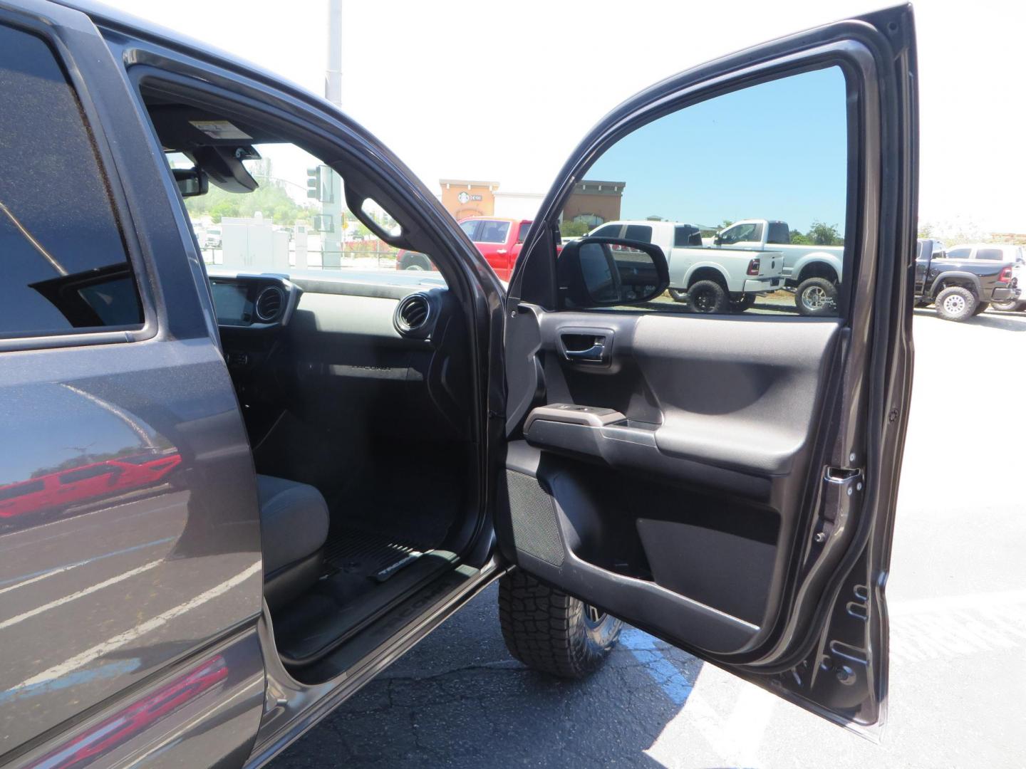 2018 CHARCOAL Toyota Tacoma TRD Sport Double Cab V6 6AT 4WD (3TMCZ5AN1JM) with an 3.6L V6 DOHC 24V engine, 6A transmission, located at 2630 Grass Valley Highway, Auburn, CA, 95603, (530) 508-5100, 38.937893, -121.095482 - Features a level kit, Nitto Terra Grappler G3 tires, TRD exhaust, and window tint. - Photo#40