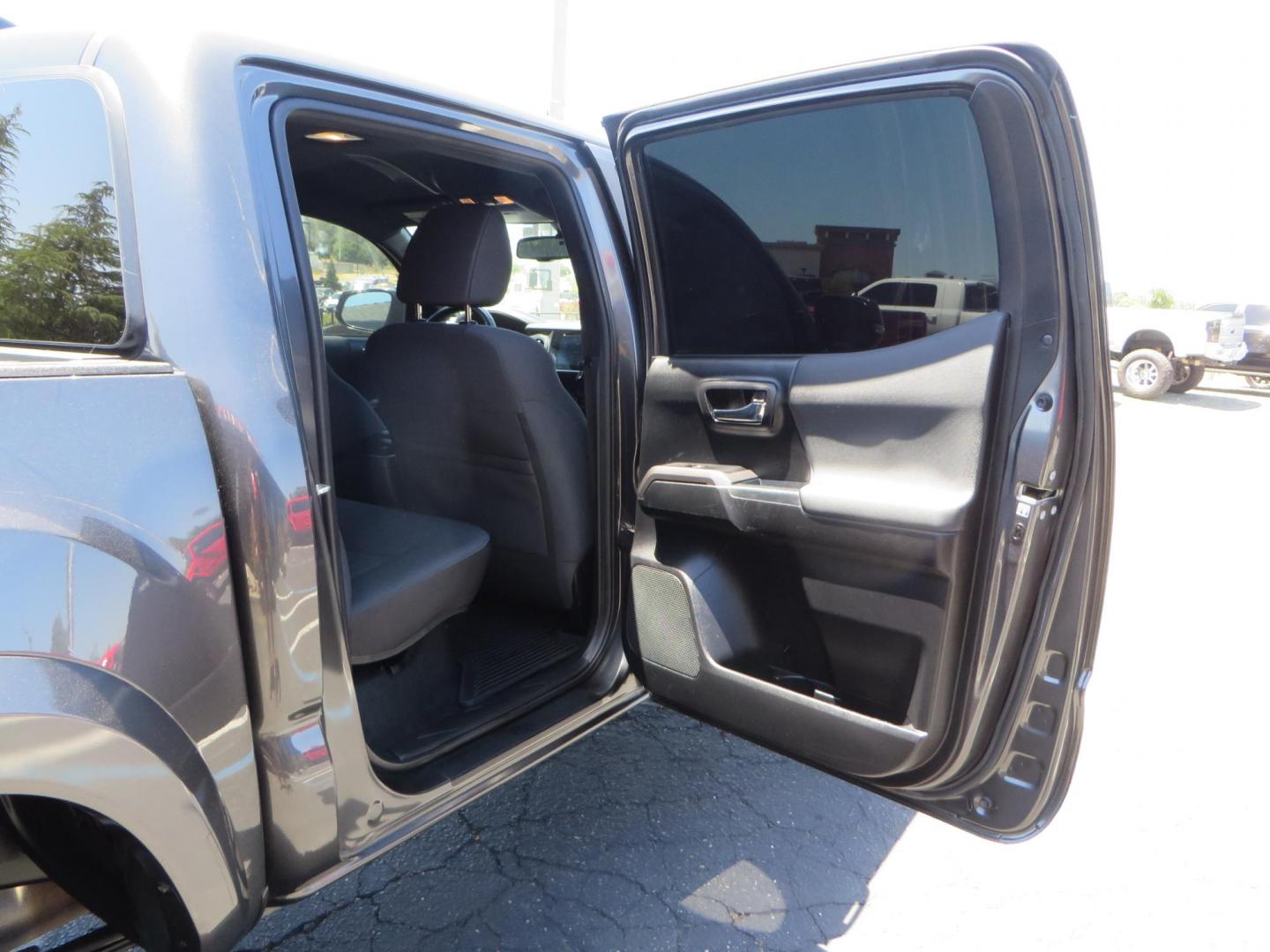 2018 CHARCOAL Toyota Tacoma TRD Sport Double Cab V6 6AT 4WD (3TMCZ5AN1JM) with an 3.6L V6 DOHC 24V engine, 6A transmission, located at 2630 Grass Valley Highway, Auburn, CA, 95603, (530) 508-5100, 38.937893, -121.095482 - Features a level kit, Nitto Terra Grappler G3 tires, TRD exhaust, and window tint. - Photo#47