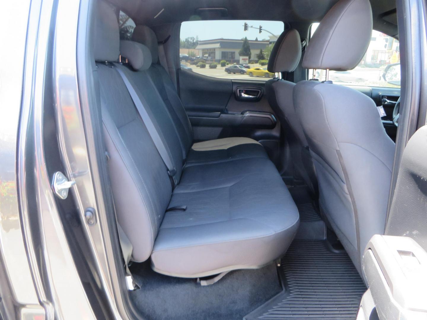 2018 CHARCOAL Toyota Tacoma TRD Sport Double Cab V6 6AT 4WD (3TMCZ5AN1JM) with an 3.6L V6 DOHC 24V engine, 6A transmission, located at 2630 Grass Valley Highway, Auburn, CA, 95603, (530) 508-5100, 38.937893, -121.095482 - Features a level kit, Nitto Terra Grappler G3 tires, TRD exhaust, and window tint. - Photo#50