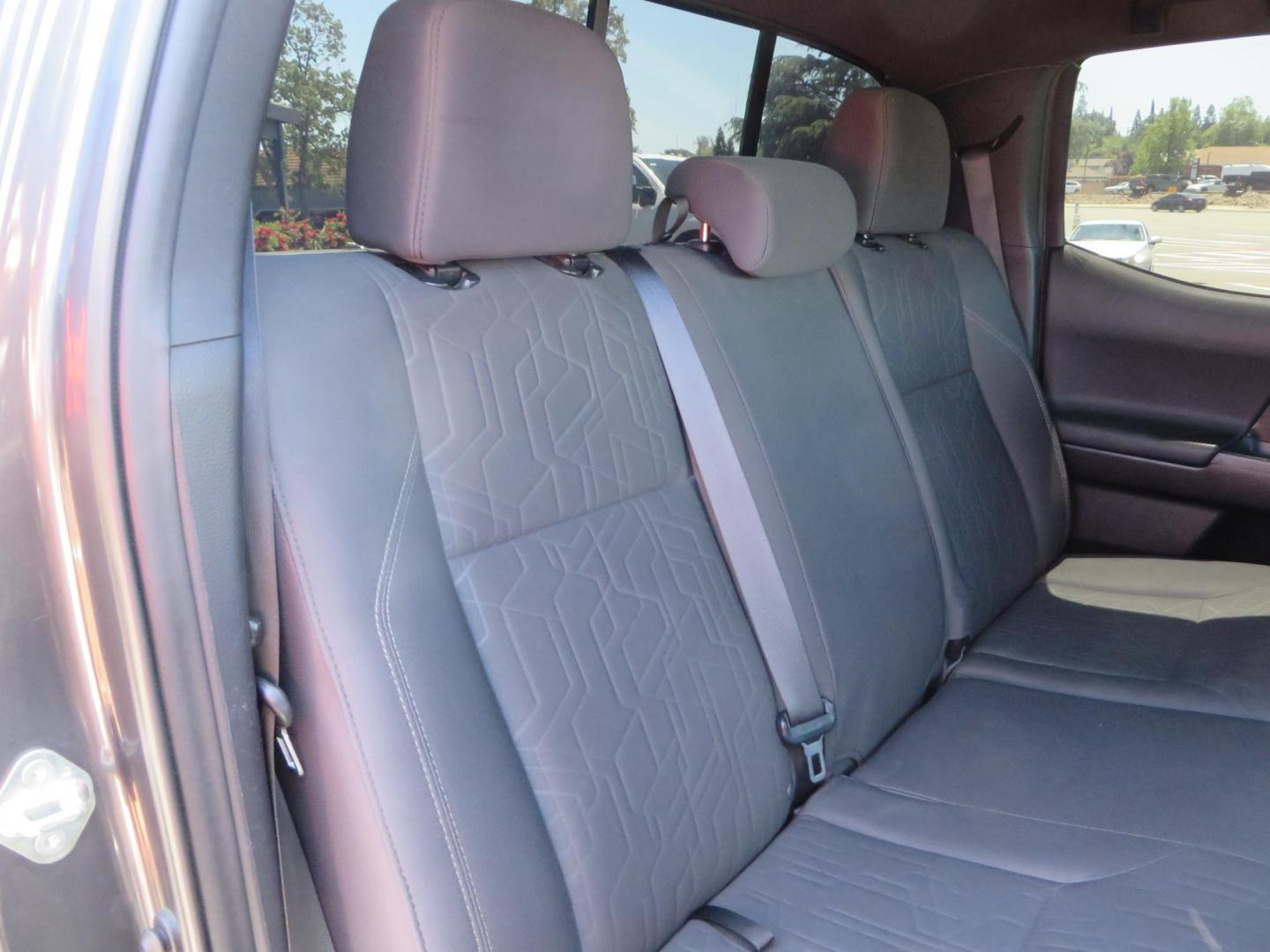 2018 CHARCOAL Toyota Tacoma TRD Sport Double Cab V6 6AT 4WD (3TMCZ5AN1JM) with an 3.6L V6 DOHC 24V engine, 6A transmission, located at 2630 Grass Valley Highway, Auburn, CA, 95603, (530) 508-5100, 38.937893, -121.095482 - Features a level kit, Nitto Terra Grappler G3 tires, TRD exhaust, and window tint. - Photo#51