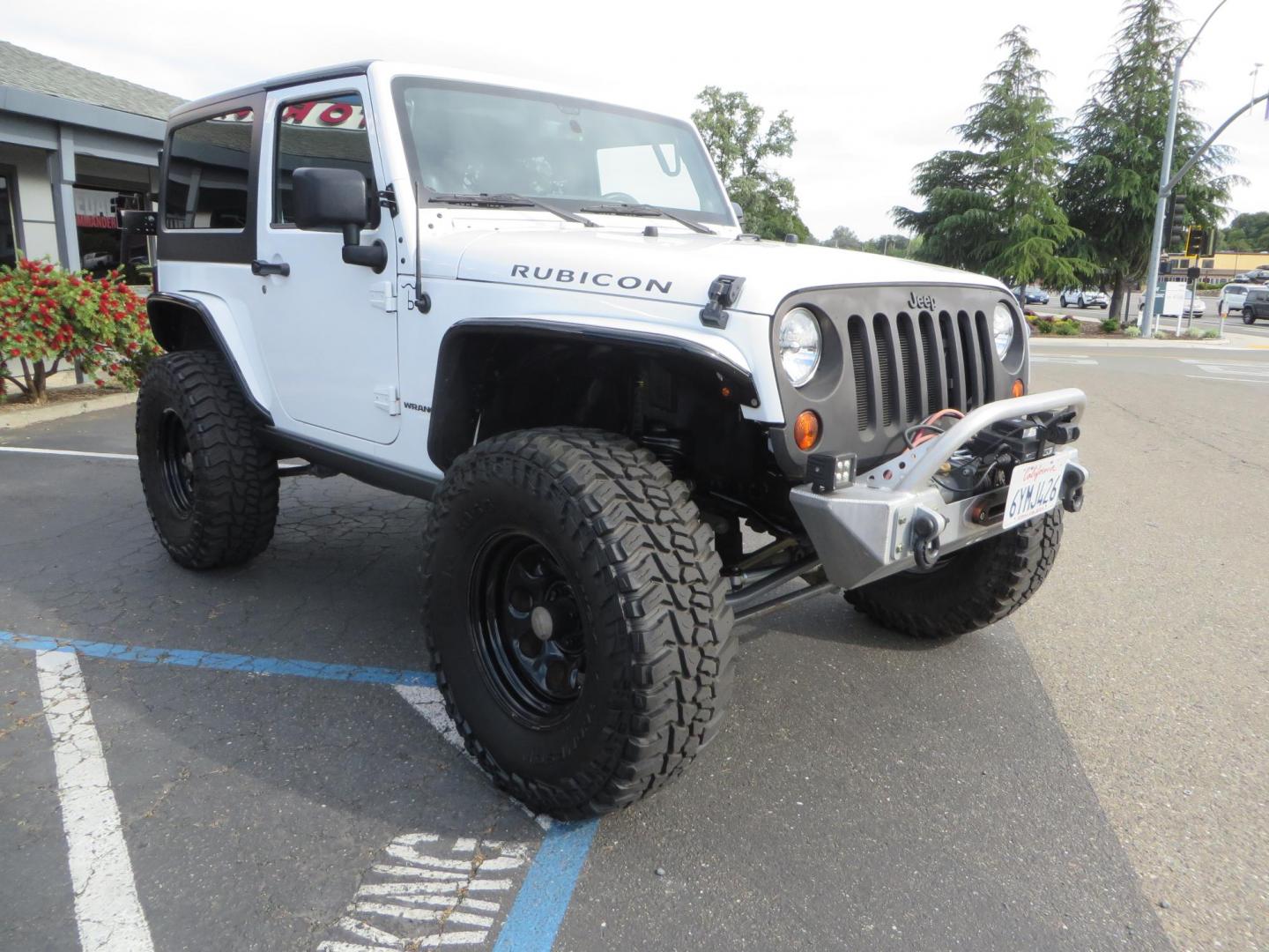 2013 White Jeep Wrangler Rubicon 4WD (1C4BJWCGXDL) with an 3.6L V6 DOHC 24V FFV engine, located at 2630 Grass Valley Highway, Auburn, CA, 95603, (530) 508-5100, 38.937893, -121.095482 - Features a Metal Cloak suspension system, Old Man EMU shocks, Ruff Stuff differential covers, Synergy steering upgrade, 37" Mickey Thompson Baja Boss tires, 17" Steel wheels, Genright front bumper, Badland Winch, LED lights, Rear Bumper, Teraflex Ice Chest rack, HIgh LIft Jack, Jerry Can mount, D Ri - Photo#2