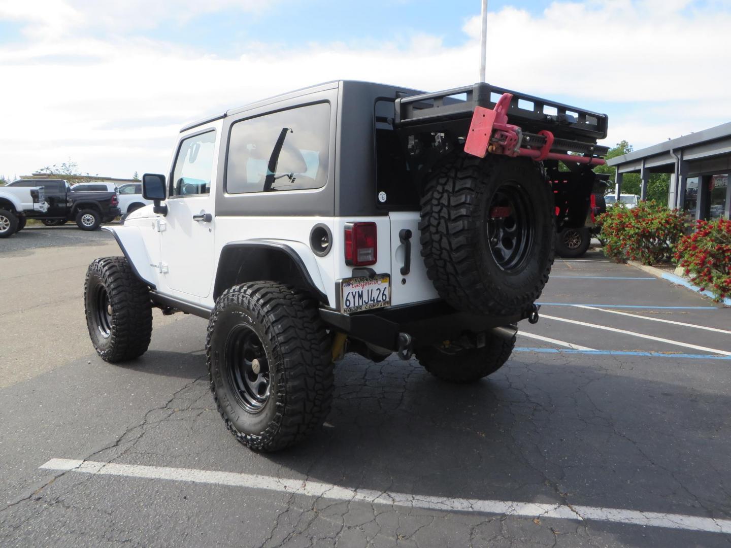 2013 White Jeep Wrangler Rubicon 4WD (1C4BJWCGXDL) with an 3.6L V6 DOHC 24V FFV engine, located at 2630 Grass Valley Highway, Auburn, CA, 95603, (530) 508-5100, 38.937893, -121.095482 - Features a Metal Cloak suspension system, Old Man EMU shocks, Ruff Stuff differential covers, Synergy steering upgrade, 37" Mickey Thompson Baja Boss tires, 17" Steel wheels, Genright front bumper, Badland Winch, LED lights, Rear Bumper, Teraflex Ice Chest rack, HIgh LIft Jack, Jerry Can mount, D Ri - Photo#6