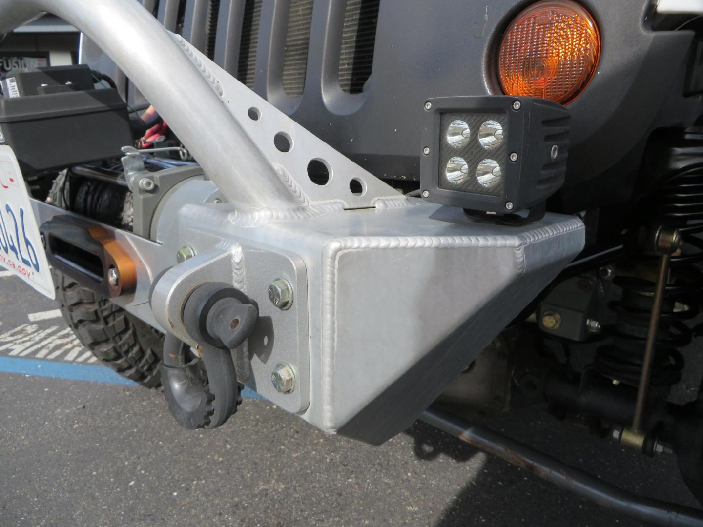 2013 White Jeep Wrangler Rubicon 4WD (1C4BJWCGXDL) with an 3.6L V6 DOHC 24V FFV engine, located at 2630 Grass Valley Highway, Auburn, CA, 95603, (530) 508-5100, 38.937893, -121.095482 - Features a Metal Cloak suspension system, Old Man EMU shocks, Ruff Stuff differential covers, Synergy steering upgrade, 37" Mickey Thompson Baja Boss tires, 17" Steel wheels, Genright front bumper, Badland Winch, LED lights, Rear Bumper, Teraflex Ice Chest rack, HIgh LIft Jack, Jerry Can mount, D Ri - Photo#11