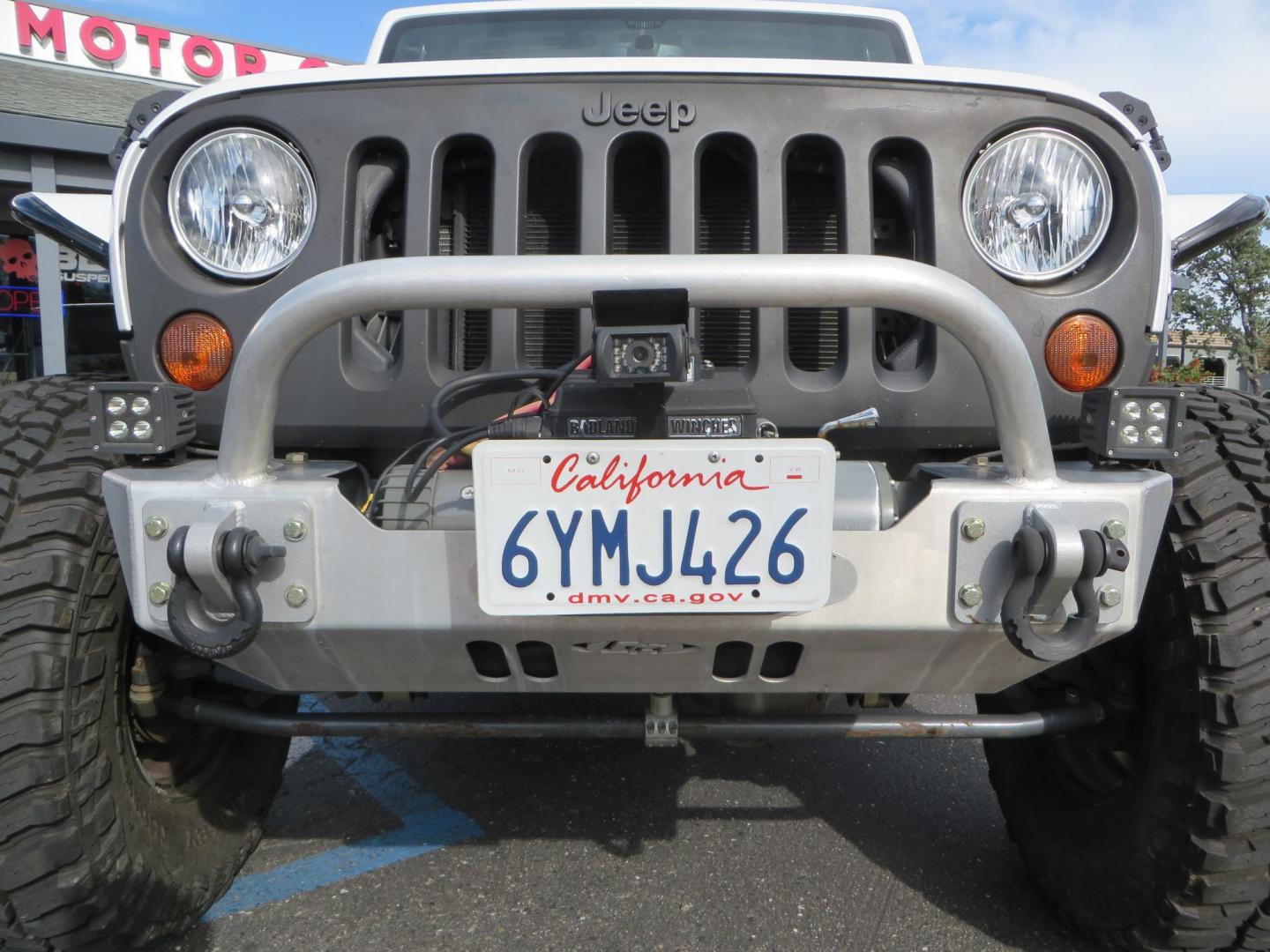 2013 White Jeep Wrangler Rubicon 4WD (1C4BJWCGXDL) with an 3.6L V6 DOHC 24V FFV engine, located at 2630 Grass Valley Highway, Auburn, CA, 95603, (530) 508-5100, 38.937893, -121.095482 - Features a Metal Cloak suspension system, Old Man EMU shocks, Ruff Stuff differential covers, Synergy steering upgrade, 37" Mickey Thompson Baja Boss tires, 17" Steel wheels, Genright front bumper, Badland Winch, LED lights, Rear Bumper, Teraflex Ice Chest rack, HIgh LIft Jack, Jerry Can mount, D Ri - Photo#10