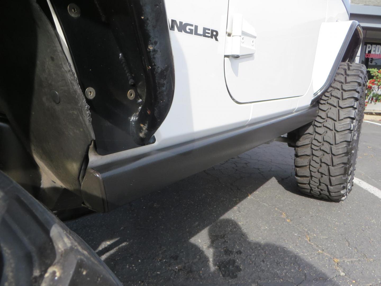2013 White Jeep Wrangler Rubicon 4WD (1C4BJWCGXDL) with an 3.6L V6 DOHC 24V FFV engine, located at 2630 Grass Valley Highway, Auburn, CA, 95603, (530) 508-5100, 38.937893, -121.095482 - Features a Metal Cloak suspension system, Old Man EMU shocks, Ruff Stuff differential covers, Synergy steering upgrade, 37" Mickey Thompson Baja Boss tires, 17" Steel wheels, Genright front bumper, Badland Winch, LED lights, Rear Bumper, Teraflex Ice Chest rack, HIgh LIft Jack, Jerry Can mount, D Ri - Photo#20