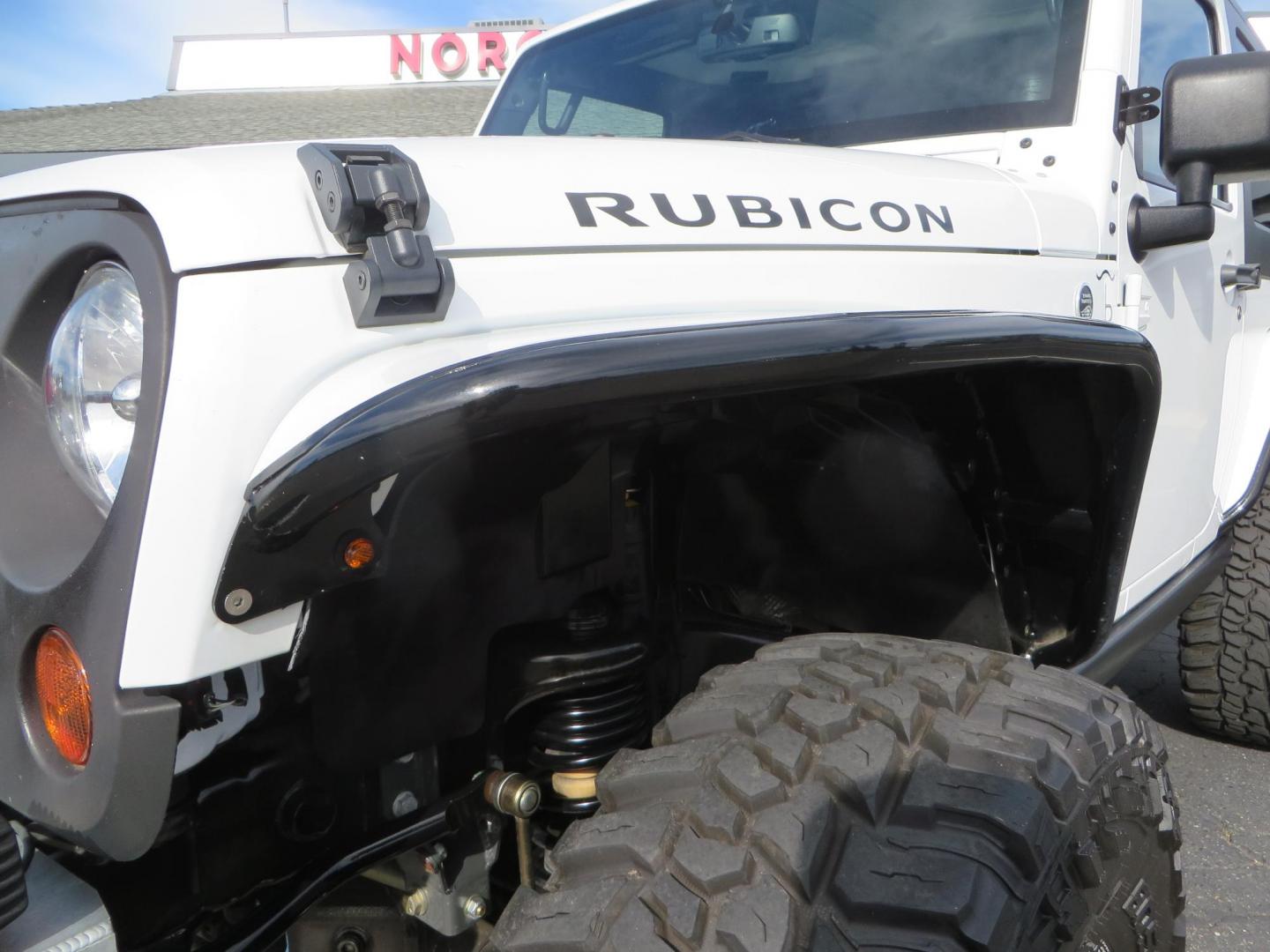 2013 White Jeep Wrangler Rubicon 4WD (1C4BJWCGXDL) with an 3.6L V6 DOHC 24V FFV engine, located at 2630 Grass Valley Highway, Auburn, CA, 95603, (530) 508-5100, 38.937893, -121.095482 - Features a Metal Cloak suspension system, Old Man EMU shocks, Ruff Stuff differential covers, Synergy steering upgrade, 37" Mickey Thompson Baja Boss tires, 17" Steel wheels, Genright front bumper, Badland Winch, LED lights, Rear Bumper, Teraflex Ice Chest rack, HIgh LIft Jack, Jerry Can mount, D Ri - Photo#21