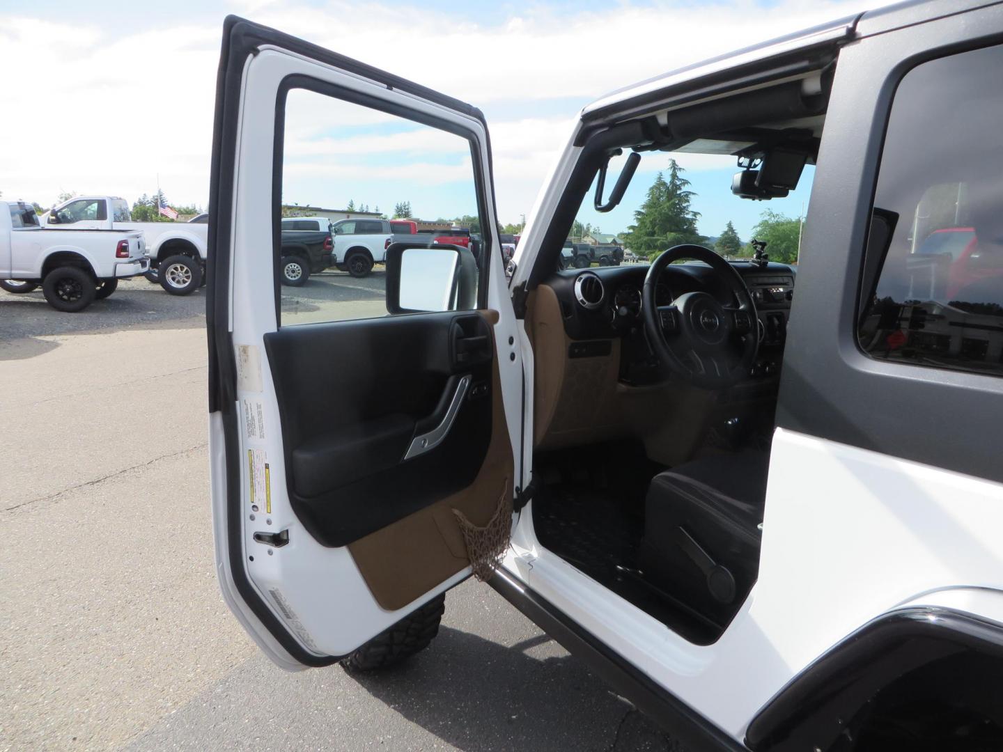 2013 White Jeep Wrangler Rubicon 4WD (1C4BJWCGXDL) with an 3.6L V6 DOHC 24V FFV engine, located at 2630 Grass Valley Highway, Auburn, CA, 95603, (530) 508-5100, 38.937893, -121.095482 - Features a Metal Cloak suspension system, Old Man EMU shocks, Ruff Stuff differential covers, Synergy steering upgrade, 37" Mickey Thompson Baja Boss tires, 17" Steel wheels, Genright front bumper, Badland Winch, LED lights, Rear Bumper, Teraflex Ice Chest rack, HIgh LIft Jack, Jerry Can mount, D Ri - Photo#25