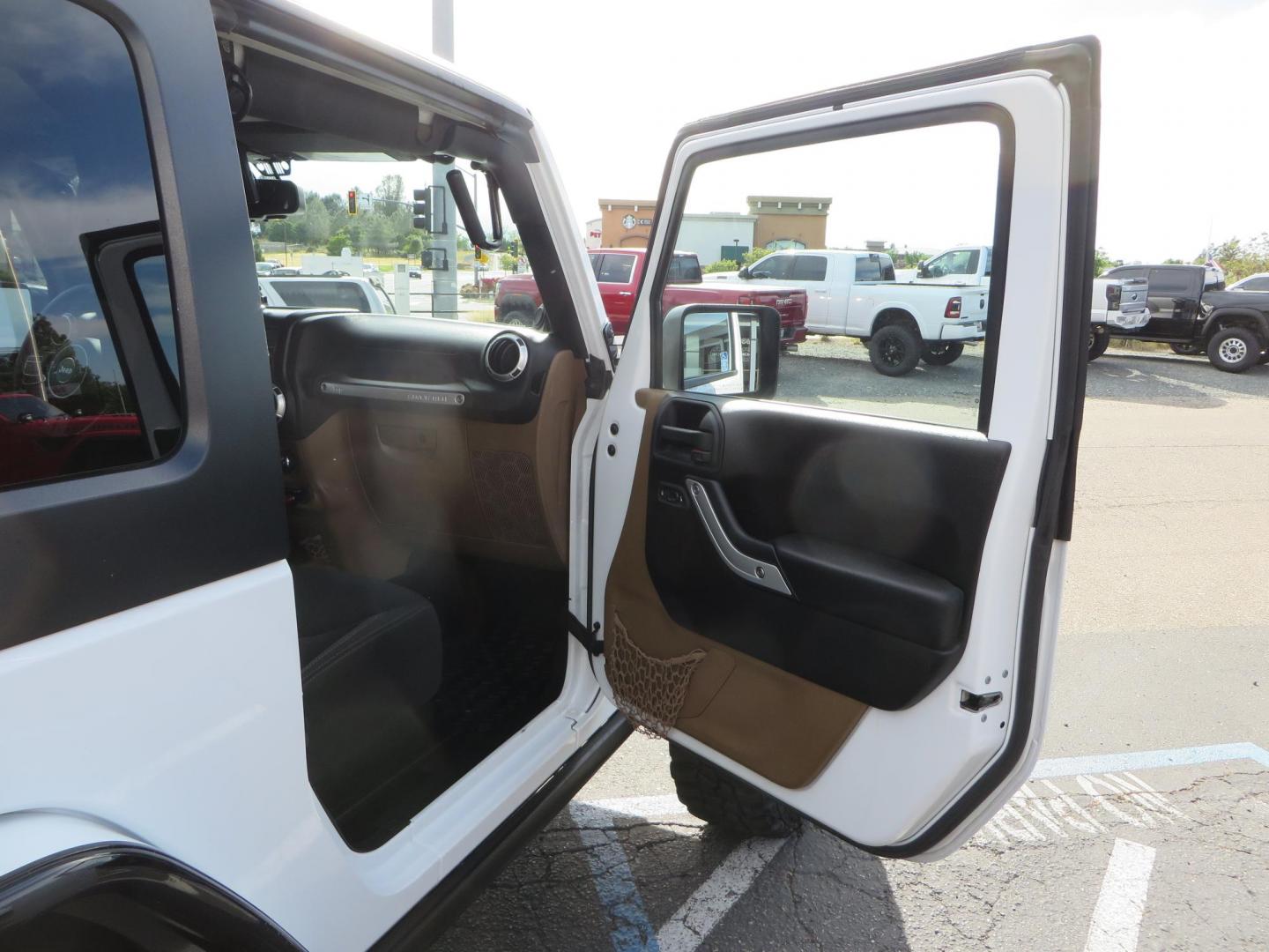 2013 White Jeep Wrangler Rubicon 4WD (1C4BJWCGXDL) with an 3.6L V6 DOHC 24V FFV engine, located at 2630 Grass Valley Highway, Auburn, CA, 95603, (530) 508-5100, 38.937893, -121.095482 - Features a Metal Cloak suspension system, Old Man EMU shocks, Ruff Stuff differential covers, Synergy steering upgrade, 37" Mickey Thompson Baja Boss tires, 17" Steel wheels, Genright front bumper, Badland Winch, LED lights, Rear Bumper, Teraflex Ice Chest rack, HIgh LIft Jack, Jerry Can mount, D Ri - Photo#46