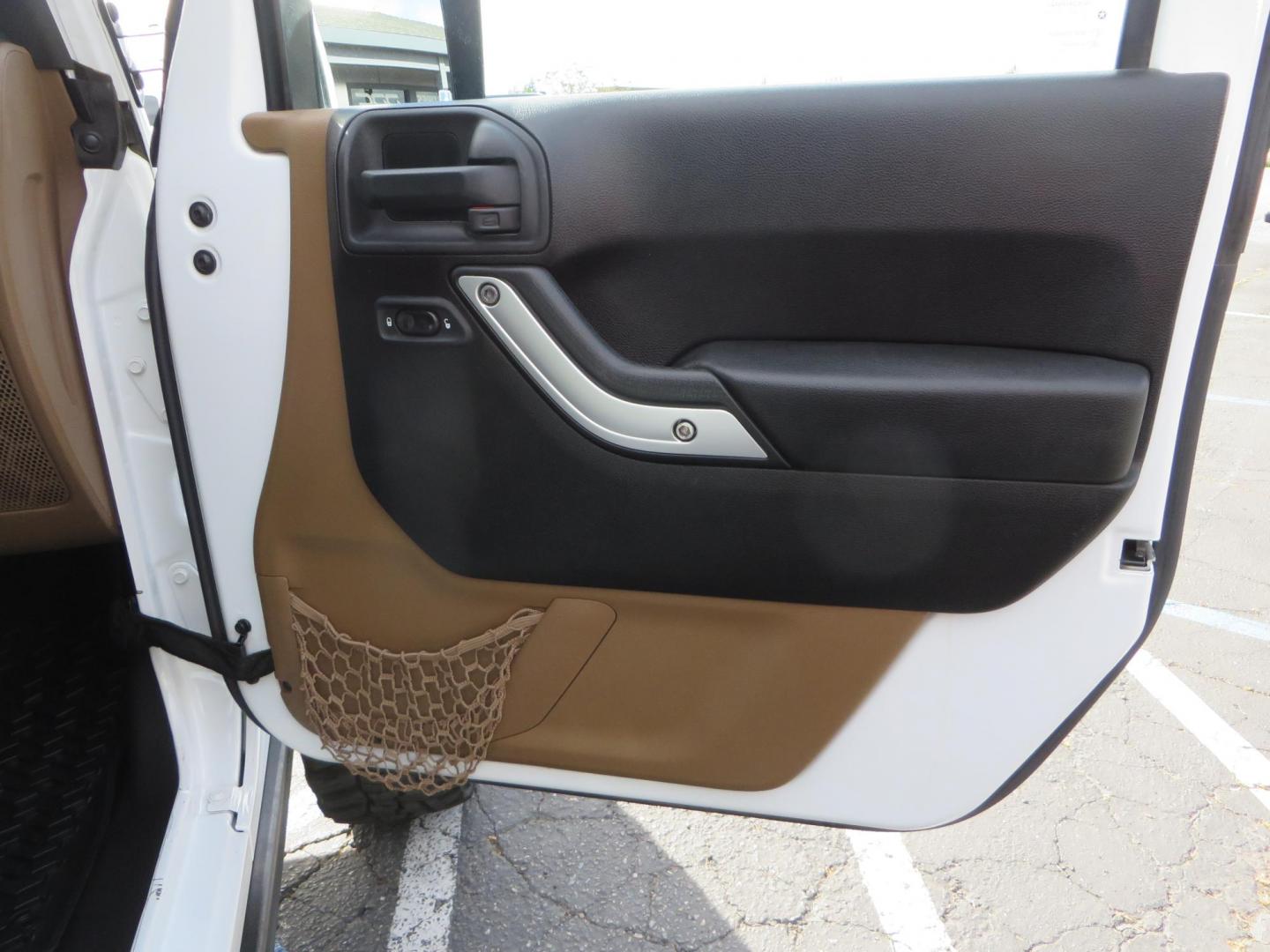 2013 White Jeep Wrangler Rubicon 4WD (1C4BJWCGXDL) with an 3.6L V6 DOHC 24V FFV engine, located at 2630 Grass Valley Highway, Auburn, CA, 95603, (530) 508-5100, 38.937893, -121.095482 - Features a Metal Cloak suspension system, Old Man EMU shocks, Ruff Stuff differential covers, Synergy steering upgrade, 37" Mickey Thompson Baja Boss tires, 17" Steel wheels, Genright front bumper, Badland Winch, LED lights, Rear Bumper, Teraflex Ice Chest rack, HIgh LIft Jack, Jerry Can mount, D Ri - Photo#47