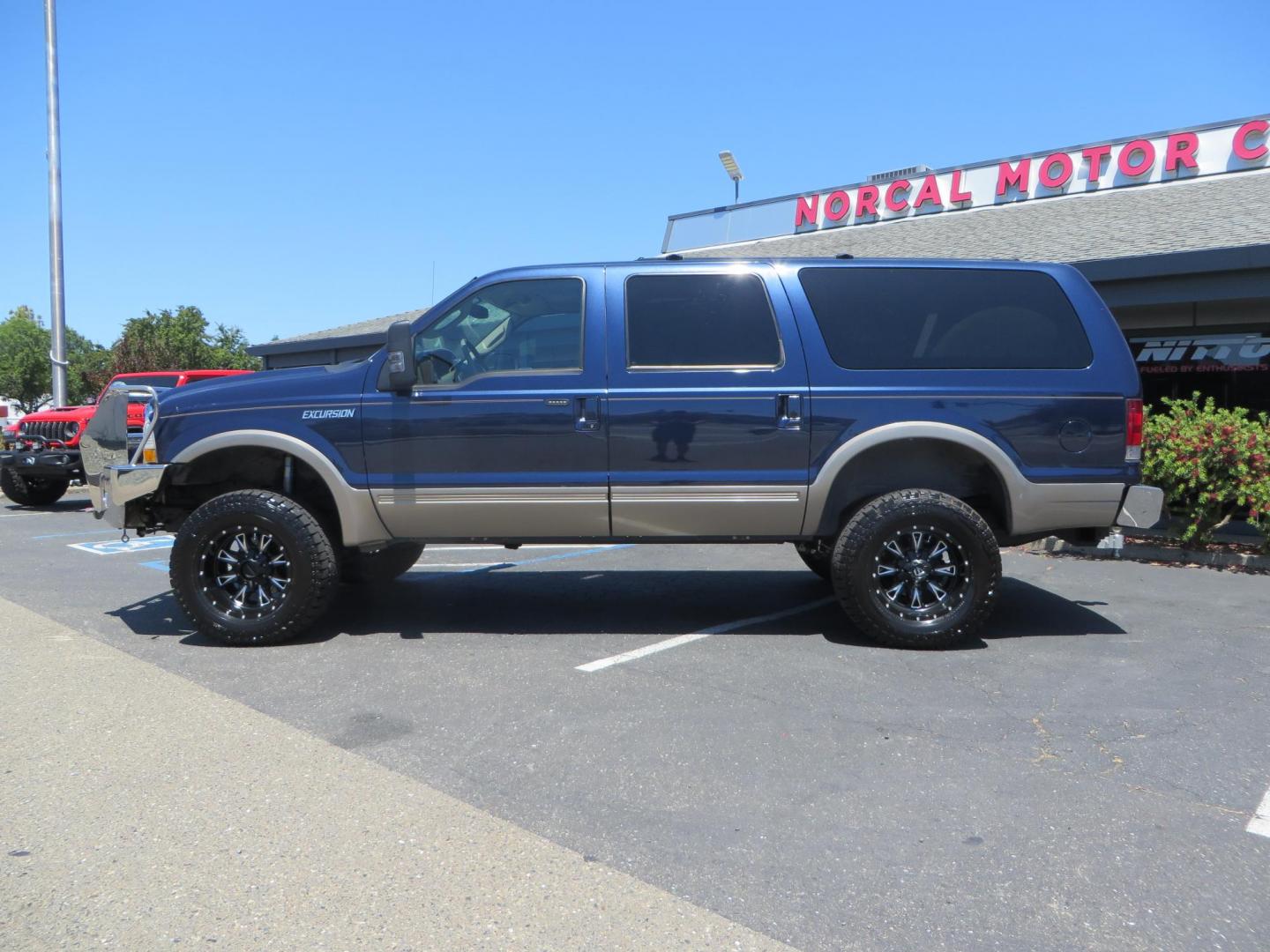 2003 Blue Ford Excursion Eddie Bauer 6.0L 4WD (1FMSU45PX3E) with an 6.0L V8 OHV 32V TURBO DIESEL engine, 5-Speed Automatic Overdrive transmission, located at 2630 Grass Valley Highway, Auburn, CA, 95603, (530) 508-5100, 38.937893, -121.095482 - Rare to find an Excursion especially like this... Extremely Clean 6.0L with ARP head studs, aluminum radiator, Lifted, Fuel wheels, Open Range AT tires, Bilstein Shocks, Amp power steps, Custom front and rear bumpers, 15K Warn Winch, Piaa Lights, RV Towable, Brake Controller, Edge Tuner CA legal, Ex - Photo#7