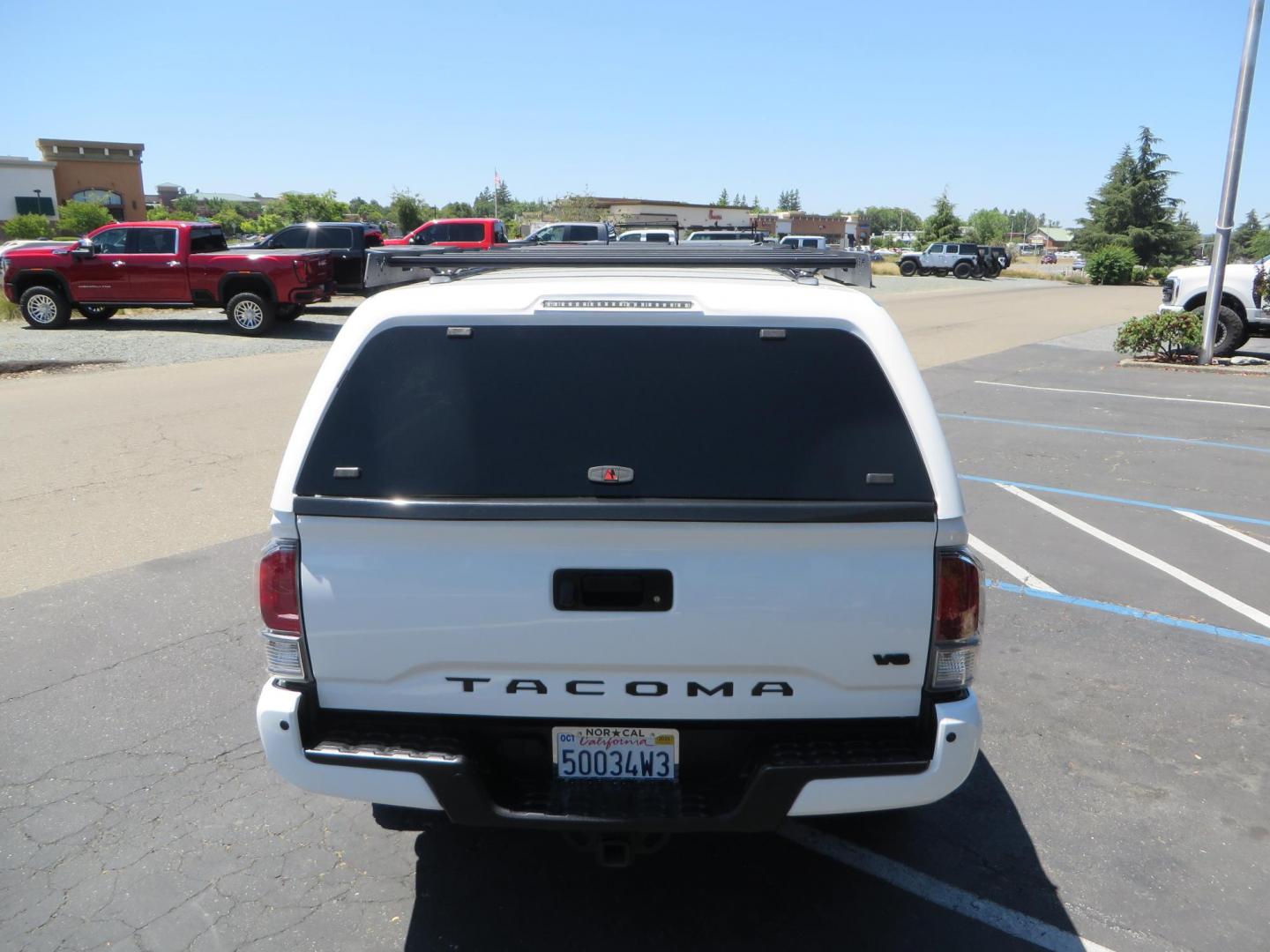 2021 White Toyota Tacoma SR5 Double Cab V6 6AT 4WD (3TMCZ5AN1MM) with an 3.5L V6 DOHC 24V engine, 6A transmission, located at 2630 Grass Valley Highway, Auburn, CA, 95603, (530) 508-5100, 38.937893, -121.095482 - Icon Vehicle Dynamics remote reservoir coilovers & shocks, Icon Upper control arms, 1552 wheels, Toyo AT3 tires, Rock Sliders, Victory 4x4 roof and camper shell rack, Leer Camper shell, Banks Idash. - Photo#10