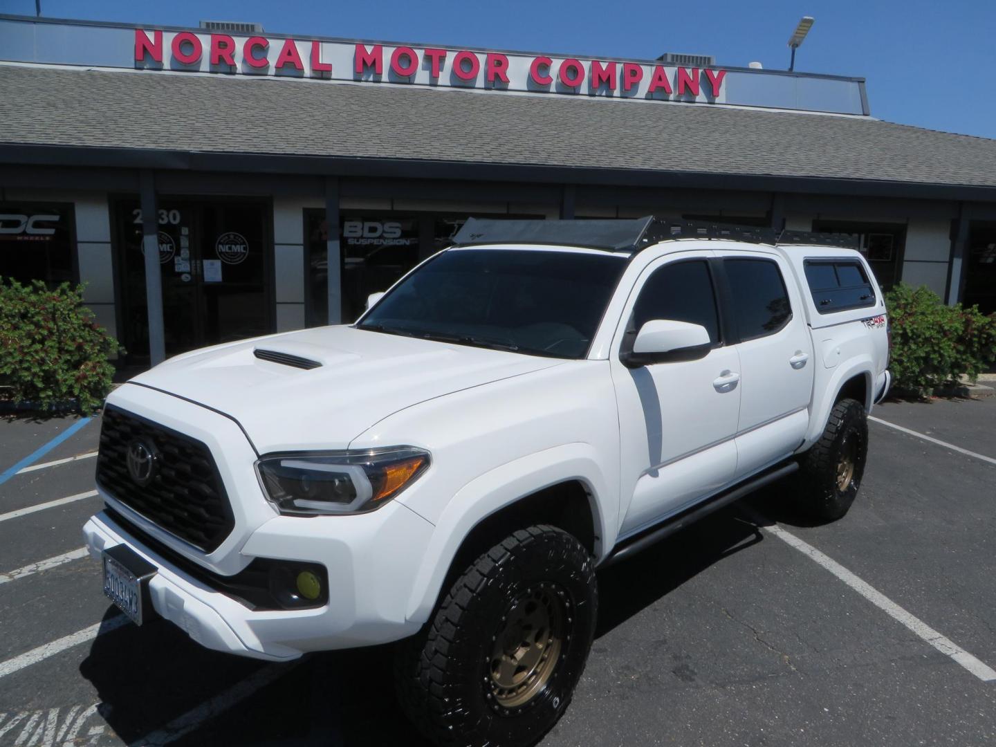 2021 White Toyota Tacoma SR5 Double Cab V6 6AT 4WD (3TMCZ5AN1MM) with an 3.5L V6 DOHC 24V engine, 6A transmission, located at 2630 Grass Valley Highway, Auburn, CA, 95603, (530) 508-5100, 38.937893, -121.095482 - Icon Vehicle Dynamics remote reservoir coilovers & shocks, Icon Upper control arms, 1552 wheels, Toyo AT3 tires, Rock Sliders, Victory 4x4 roof and camper shell rack, Leer Camper shell, Banks Idash. - Photo#15