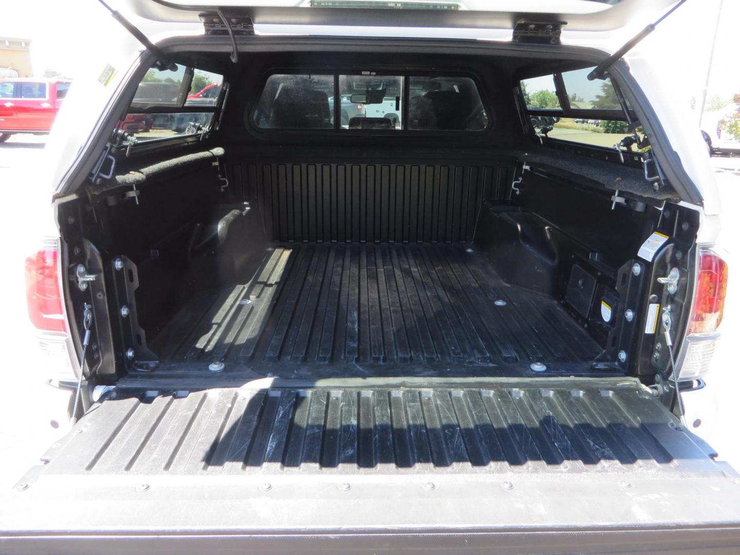 2021 White Toyota Tacoma SR5 Double Cab V6 6AT 4WD (3TMCZ5AN1MM) with an 3.5L V6 DOHC 24V engine, 6A transmission, located at 2630 Grass Valley Highway, Auburn, CA, 95603, (530) 508-5100, 38.937893, -121.095482 - Icon Vehicle Dynamics remote reservoir coilovers & shocks, Icon Upper control arms, 1552 wheels, Toyo AT3 tires, Rock Sliders, Victory 4x4 roof and camper shell rack, Leer Camper shell, Banks Idash. - Photo#35