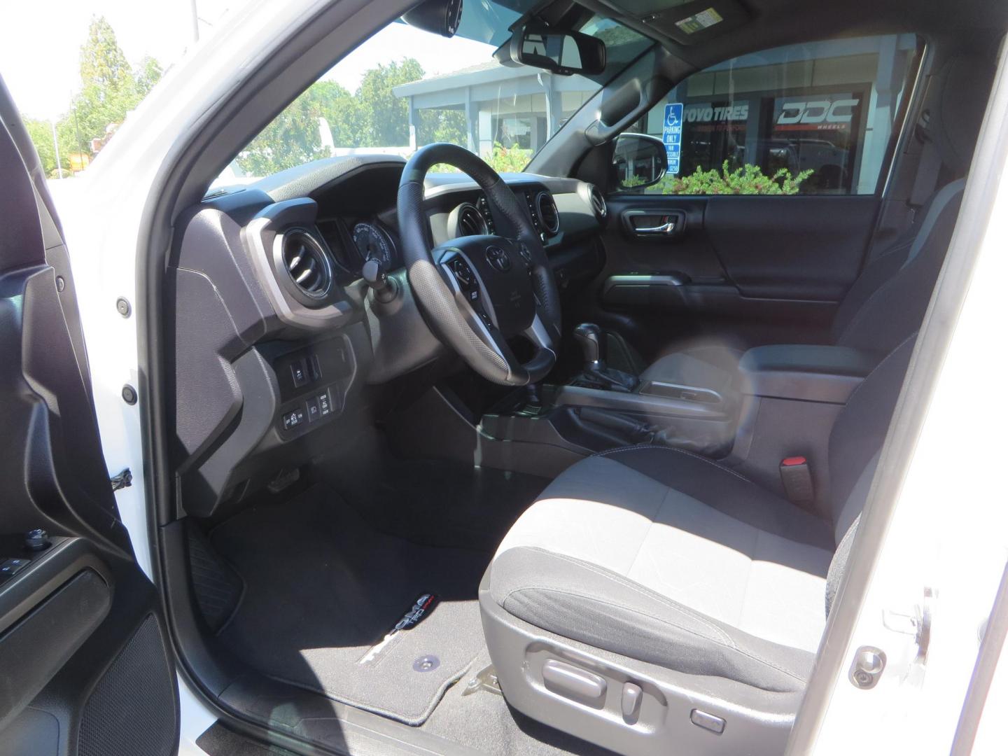 2021 White Toyota Tacoma SR5 Double Cab V6 6AT 4WD (3TMCZ5AN1MM) with an 3.5L V6 DOHC 24V engine, 6A transmission, located at 2630 Grass Valley Highway, Auburn, CA, 95603, (530) 508-5100, 38.937893, -121.095482 - Icon Vehicle Dynamics remote reservoir coilovers & shocks, Icon Upper control arms, 1552 wheels, Toyo AT3 tires, Rock Sliders, Victory 4x4 roof and camper shell rack, Leer Camper shell, Banks Idash. - Photo#38